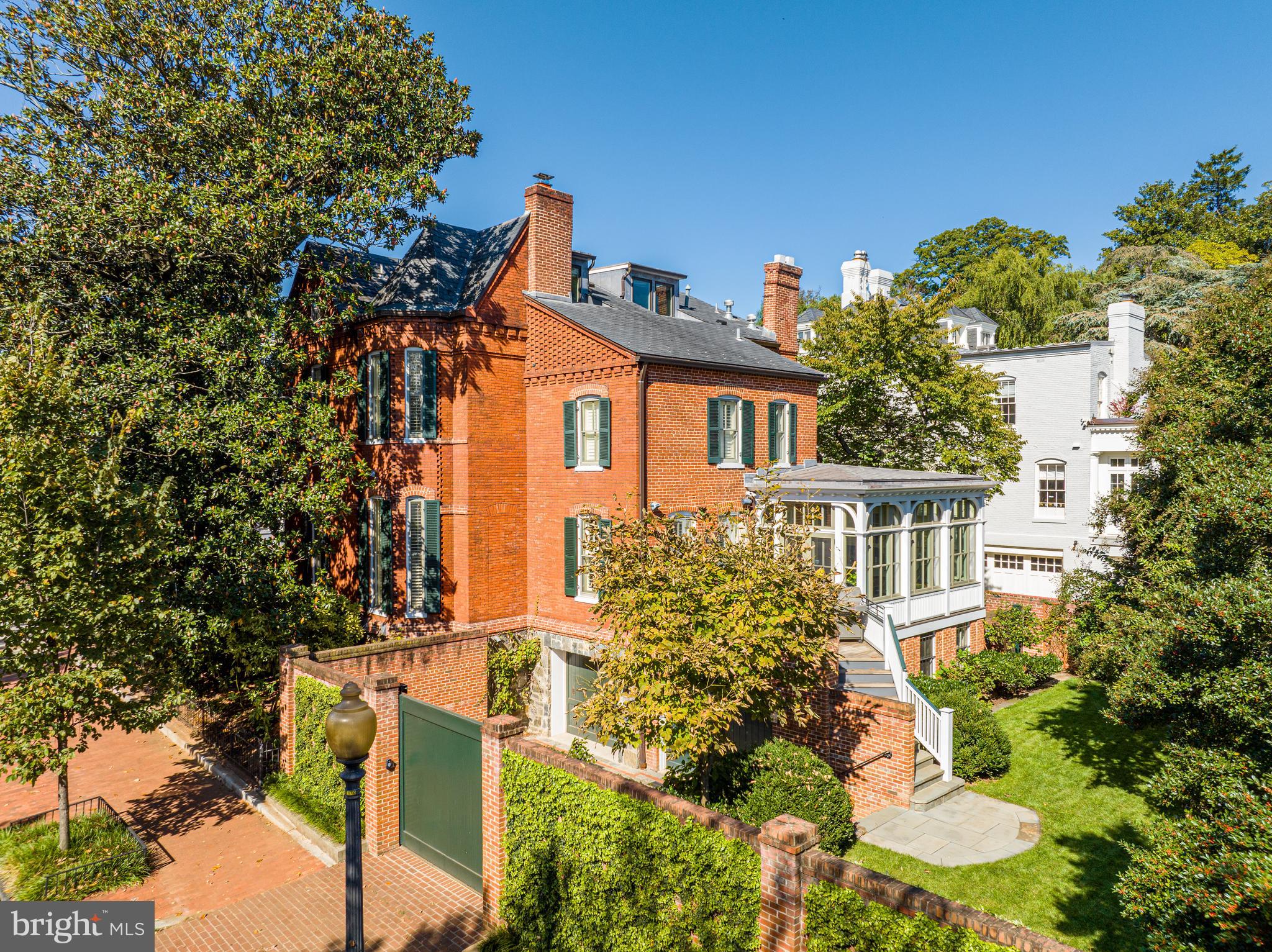 Sited on a charming and large 0.14-acre corner lot in Georgetown, 1601 28th St NW presents a masterfully crafted, stately Victorian, offering a seamless blend of comfort and ageless sophistication. Originally built circa 1880 along with two other homes within the historic Evermay Estate, the residence boasts 5 Bedrooms, 5 Full Bathrooms, and 1 Half Bathroom across 4 Levels and approximately 6,100 total square feet. The Main Level impresses with soaring 10'9” ceilings and features an inviting Foyer leading to spacious formal Living and Dining Rooms, ideal for entertaining. The Gourmet Kitchen features a Butler’s Pantry, Breakfast Area, and seamlessly flows into a connecting Family Room, with easy access to the rear Deck and flat rear garden, perfect for indoor/outdoor entertaining. The Upper Level is adorned with 10’ ceilings, and features 2 Bedroom Suites, to include the luxurious Primary Suite with a large walk-in closet, a Laundry Room, Office, and Sitting Room, providing endless comfort and functionality. The Third Level is home to two additional Bedroom Suites and ample Attic and Utility space. The multifunctional Lower Level is a versatile retreat, with an In-Law Suite/5th Bedroom Suite, a Kitchenette, as well as a Laundry/Utility/Storage Room. Direct access to the 2-car Garage, Gated Motor Court, and rear garden provides convenience and ease of living. Located in one of Washington, D.C.'s most desirable neighborhoods, 1601 28th St NW, offers a rare combination of privacy, luxury, and proximity to all Georgetown has to offer. Zoned for Hyde-Addison ES, Hardy MS, and Jackson-Reed HS. The property is close to Montrose Park, Dumbarton Oaks, Georgetown Library, and all of the shops and restaurants along Wisconsin and M Streets.