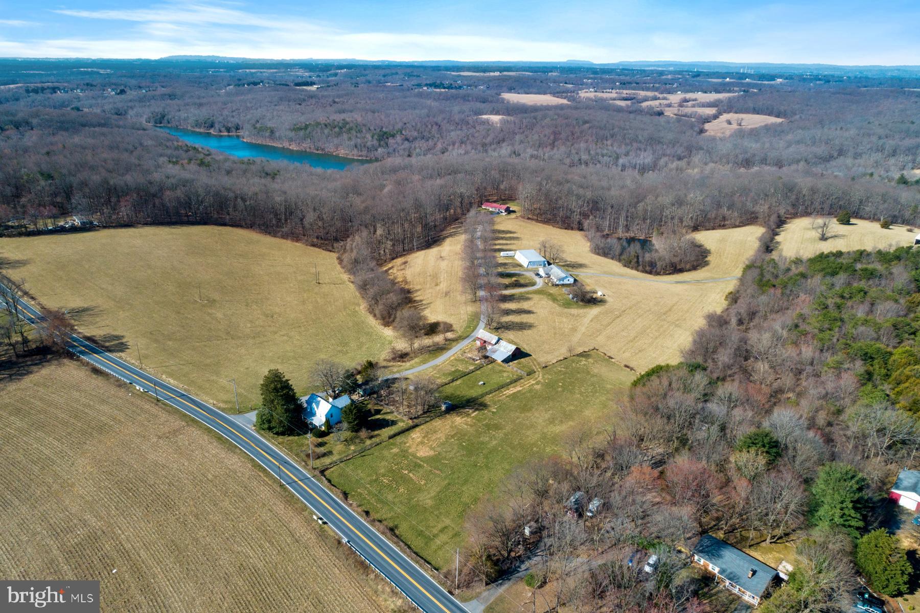 Wow!  So much to try and convey about this amazing property. This sale is for two parcels of land totaling over 56 acres stretching from Clarksburg Road to Old Baltimore Road (the second parcel has an address of 14700 W Old Baltimore Rd and tax ID of 160200019497). This property which backs to parkland has so much to offer including 3 habitable homes (think commune), multiple sheds and outbuildings, private stocked pond, views of Sugarloaf Mountain and so much more. Keep this property as a farm, use it as your retreat, create a bed and breakfast, rent through AirBnB, or look at the possible subdivision potential (study plan conducted in 2018 indicating potential for 17 lots).  First home has 2 bedrooms, 1.5 baths, second home has 3 bedrooms, 2 baths and third home has 3 bedrooms, 2 baths. The current owners were generating about $70K annual income recently with potential for much more. All of this is just about 1.5 miles from the outlets and I-270. Nearby you have many parks (Black Hill Regional Park, Seneca Creek State Park, Stream Valley Park, Waters Landing and Great Seneca Stream Park). SHOWN BY APPOINTMENT ONLY!