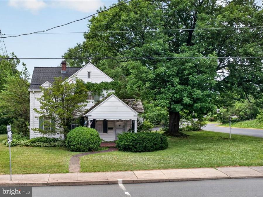 Opportunity to own a beautiful stately home and bring your own desires to make it your own.   Being sold in "as is" condition with Buyer being responsible for the Borough Use and Occupancy.   Enjoy the Large .54 acre 2 parcel lot.   Detached 3 car garage provide off street parking and storage.   Front porch,  Side porch, upper roof deck all reminiscent of the local farmhouse.   A large updated kitchen with main level laundry area and half bath add convenience.   Built in lighted curio cabinets in the dining room to showcase the china and family heirlooms.  A large living room is open and spacious with  your front door foyer on one side and a dark wood office with built in book shelves on the far side of the room.   Upstairs the main bedroom as will as the 2 additional bedrooms all have hardwood floors. The second bedroom features a cedar closet. A full attic also provides wonderful storage space.  This is a home waiting to be filled with warmth and laughter and holiday dinners.