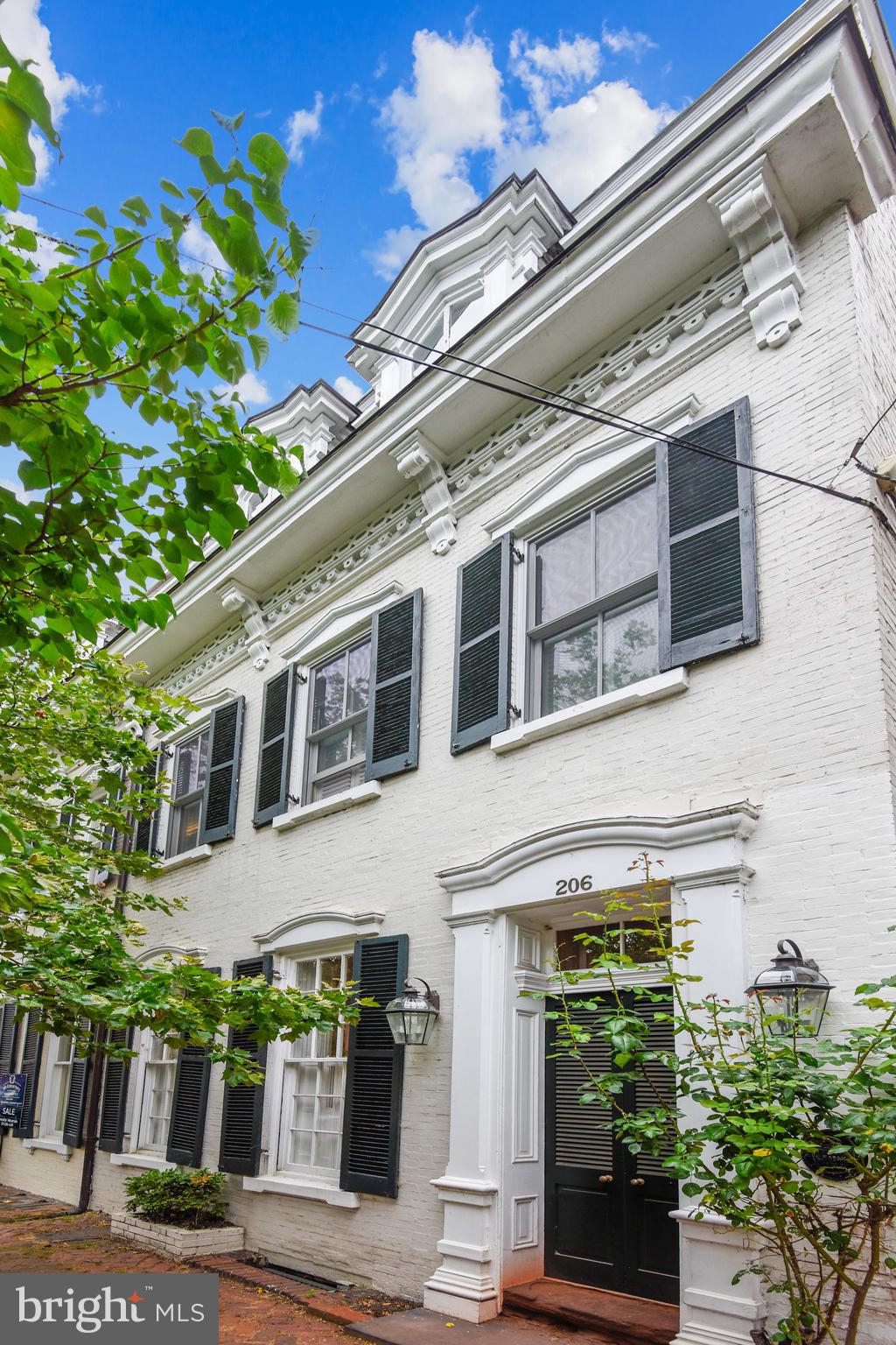 Stop by and view this beautiful home!!! 206  N Royal Street is located on one of the prettiest streets in Old Town.  Built in 1840, it is "included within the ranks of Plaqued  houses " in Alexandria .  High ceilings, spacious rooms, hardwood floors, three wood burning fireplaces, add to its elegance. The gourmet kitchen will excite you! The floor plan is perfect for  entertaining large or small  groups. Master bedroom  with  lots of sunlight is large enough  for a couch. Walk in closet and  elegant master bath with double sinks. There is a 2nd bedroom and study  with built-in's and fireplace for working or relaxing.  Upper 2 level has two bedrooms and hall bath.  Lower level has a family room and full bath. Lots of storage. Private enclosed patio for cook outs or quiet reading. Welcome Home! Open Sun Oct 4. 2-4
