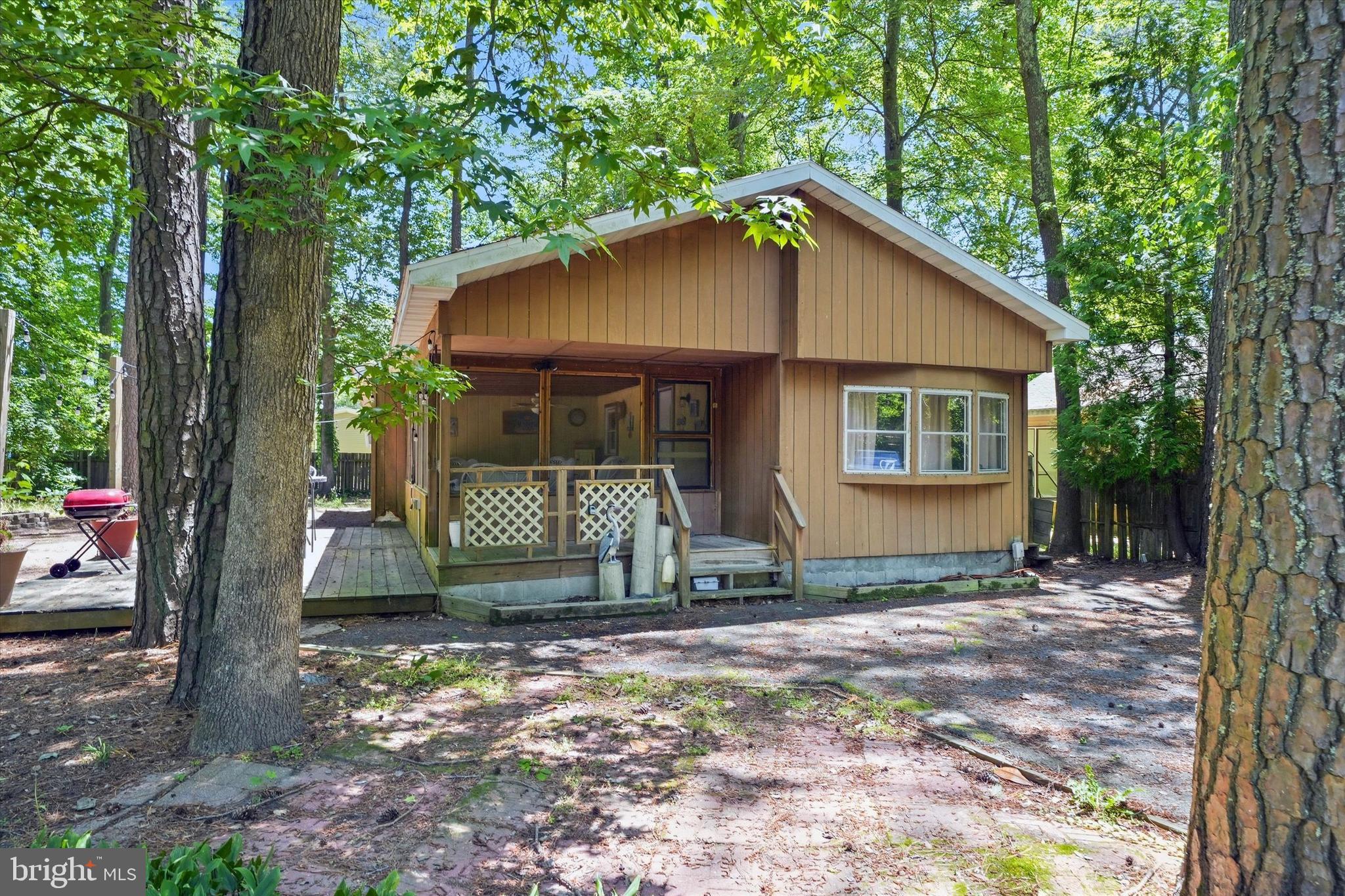 Escape to your own private beach retreat! Nestled on a peaceful wooded lot, this  3 bedroom, 2 bath ranch offers the perfect blend of relaxation, convenience, and coastal living. Whether you're looking for a full-time residence, weekend getaway, or investment opportunity, this home is move-in ready with a newer HVAC system (2022) and new roof (2024) already in place.

Spend your days soaking up the sun and exploring Delaware's beautiful beaches, then return home to unwind in your tranquil wooded setting. With comfortable one-level living and plenty of space for family and guests, this home is the perfect place to rest your head after a day on the beach.

Ideally located just 10 minutes from Bethany Beach, 20 minutes from Dewey Beach, and 20 minutes from Ocean City, you'll enjoy easy access to some of the area's best dining, shopping, entertainment, and waterfront attractions.

The best part? No land lease here, you own the home and the land, giving you the freedom, value, and peace of mind that coastal buyers are looking for. Don't miss this opportunity to own an affordable beach getaway in a prime location!