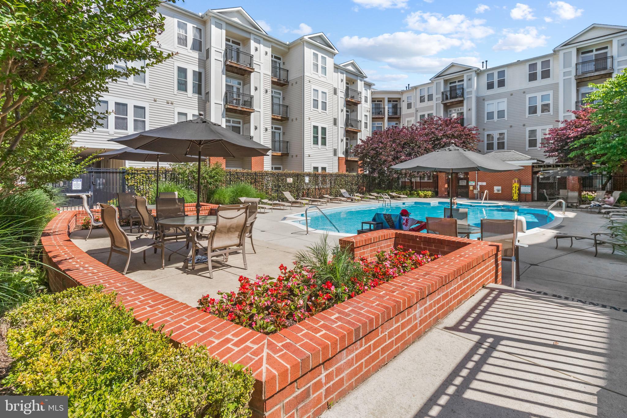 Freshly painted and filled with natural light, this top-floor 2-bedroom, 2-bath condo offers beautiful pool views and an open, inviting feel throughout. The kitchen features granite countertops, stainless steel appliances, and the convenience of in-unit laundry, while a brand-new HVAC system adds peace of mind. Two garage parking spaces provide added ease and convenience.

Enjoy an impressive list of building amenities, including 24-hour front desk service, a fitness center, outdoor pool, indoor basketball court, party room, business center, and media room. Ideally located just steps from the Dunn Loring Metro, with endless dining, shopping, and grocery options nearby, plus quick access to the popular Mosaic District. This condo truly offers the perfect blend of comfort, convenience, and lifestyle!