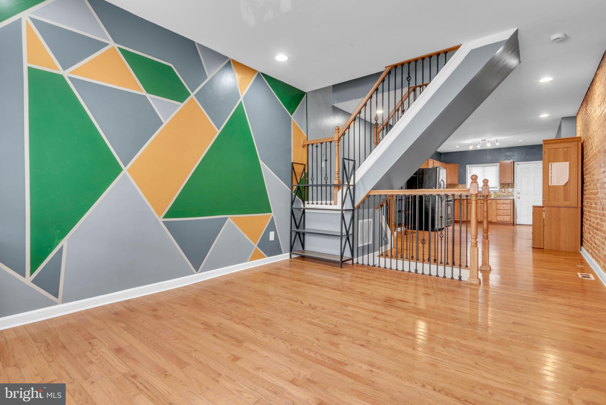 Welcome to 3912 Mount Pleasant Avenue — a striking contemporary residence where modern design and classic Baltimore character converge seamlessly.

From the moment you enter, you are greeted by original exposed brick and rich hardwood flooring that flows throughout the main living space, creating warmth and architectural depth. The open-concept layout offers effortless flow, ideal for both everyday living and entertaining.

The updated kitchen is thoughtfully appointed with stainless steel appliances, granite countertops, and generous cabinet and prep space — a true centerpiece for gathering. Modern conveniences include smart locks, a smart thermostat, and an updated water heater, enhancing both efficiency and security.

Major improvements include a newer roof (2016) and key structural components, providing peace of mind for years to come.

The unfinished basement adds valuable flexible space — perfect for a recreation room, home office, gym, or guest retreat. Step outside to a fully fenced rear yard offering privacy and outdoor enjoyment rarely found at this price point.

Ideally located in Baltimore with convenient access to shopping, dining, and major commuter routes, this home offers exceptional value in a highly desirable setting.

Well-positioned and beautifully presented — opportunities like this do not linger. Schedule your private showing today.