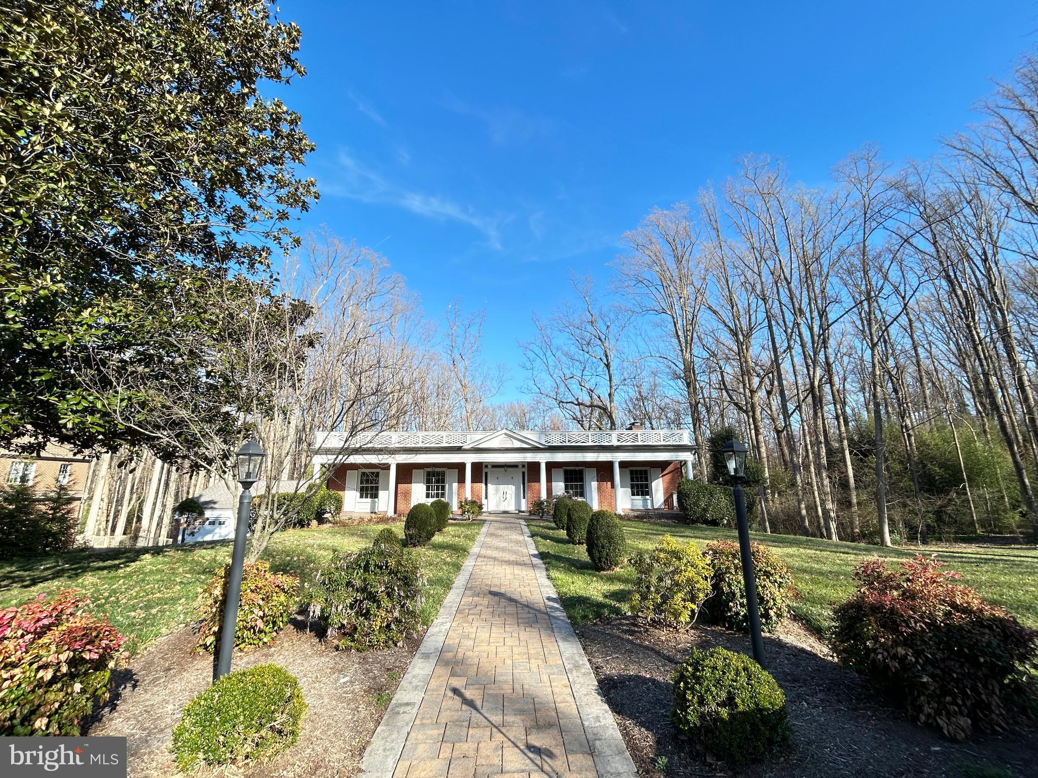 Nestled in McLean’s exclusive Old Georgetown Estates, this remarkable 6-bedroom, 3-bath residence sits on a private, beautifully landscaped 1-acre lot backing to tranquil, mature trees. Enjoy the ease of one-level living, highlighted by elegant hardwood floors, classic moldings, and two cozy fireplaces. Step from the living room onto a spacious Trex patio for seamless indoor-outdoor flow and gorgeous views. The expansive walk-out lower level, bathed in natural light, leads to a large patio—ideal for outdoor entertaining or serene relaxation. The property includes a detached two-car garage with a convenient pull-down attic for additional storage, plus extra parking spaces. Situated near three McLean Metro stops—downtown McLean, Tysons Corner, and Rt 7—this location offers effortless access to I-495, I-66, Route 267, and Dulles International Airport. Families will value the home’s inclusion in the prestigious Langley High School pyramid, feeding into Spring Hill Elementary and Cooper Middle. Notable updates include a 5-year-old roof, furnace and hot water heater (5-7 years old), durable Marvin windows, and a generator installed in 2001. This inviting property provides privacy, ample space, and unparalleled convenience in one of McLean’s most distinguished neighborhoods. Seize this rare opportunity! ***FRESHLY PAINTED***
