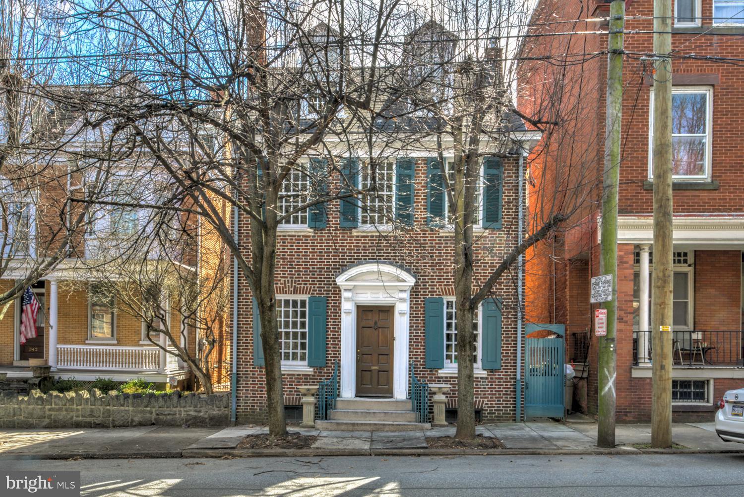A rare opportunity to own a detached single family home on the charmed 300 block of E Orange St in Lancaster City. 
You can have it all! A piece of Lancaster City history; this single-family home offers charming, ample living space, multiple bathrooms, a large yard, an oversized garage, and is walkable to everything downtown. 
The front door opens to the living room, which features a fireplace and a spacious sitting area with built in bookshelves that opens up to the sun room. The dining room displays more built in shelves and windows for increased natural light. The kitchen features high ceilings, another fireplace, and a half bath at the back of the house.
The curved banister in the living room leads you upstairs. The second floor hosts an office/reading nook/play area, a bedroom with an ensuite bathroom, 2nd floor laundry, exposed brick bathroom and a second bedroom with fireplace and balcony. The third floor holds the third bedroom, which features a private half bath and a charming Dutch door.
Out back holds what everyone hopes to see: a patio area for gathering & outdoor dining in addition to a large fenced yard leading to the oversized two car garage and extra off street parking. Located just a block and a half from Musser Park, this single family, stand alone house has all the charm of the old city with original hardwood floors, gorgeous windows and original woodwork—along with modern conveniences like an oversized garage. Ask about seeing the shared home inspection report and recent appraisal report ($740,000 appraised value!) as well as plans for potential garage renovation and addition to increase living space.
Welcome Home!