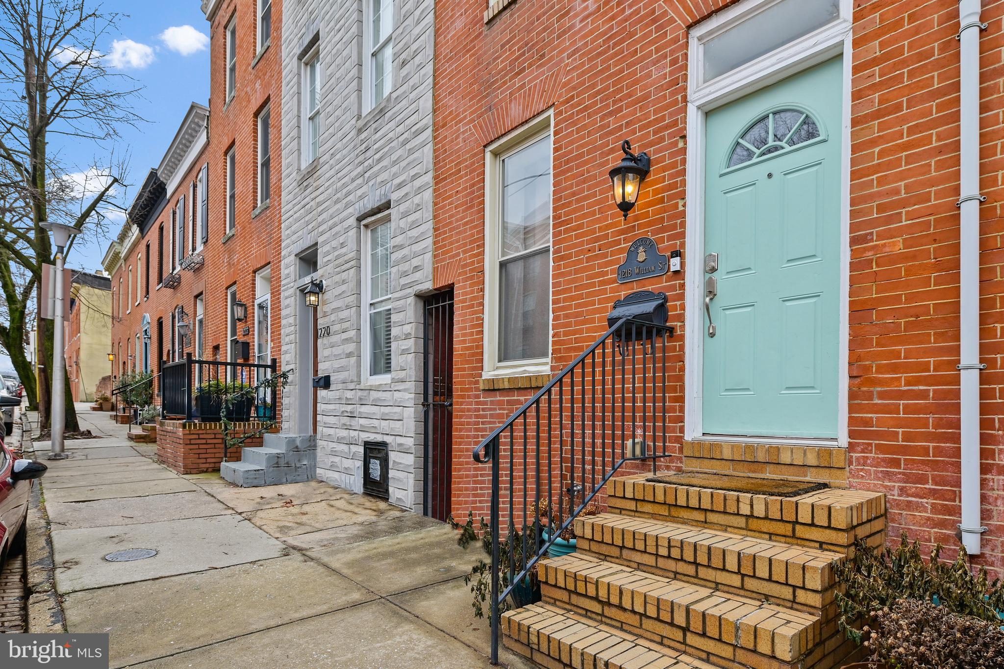 Gorgeous 4 level home in the heart of Federal Hill! This home shows like a model! Living room with exposed brick on both sides, hardwood floors, open stairs with wrought iron rails. The kitchen includes raised panel cabinets, granite counters, under cabinet lighting, new backsplash, and stainless steel appliances. Eating area or home-office space off of the kitchen. Three above ground bedrooms each with private full baths inside, no basement bedrooms! Large, private back patio with wood panel fencing and brick garden bed area. The second floor has two ensuite bedrooms with a hidden laundry area. The master bedroom on the second floor has large his-her closets and a spa tub! The third floor has a second master-sized ensuite bedroom with spa tub, walk-in closet and wet bar. Basement level is finished with a half bath and is perfect for entertaining! Two zone heating. 

Parking garage behind house with monthly payment plans. Parking lot on block included in permitted parking area.