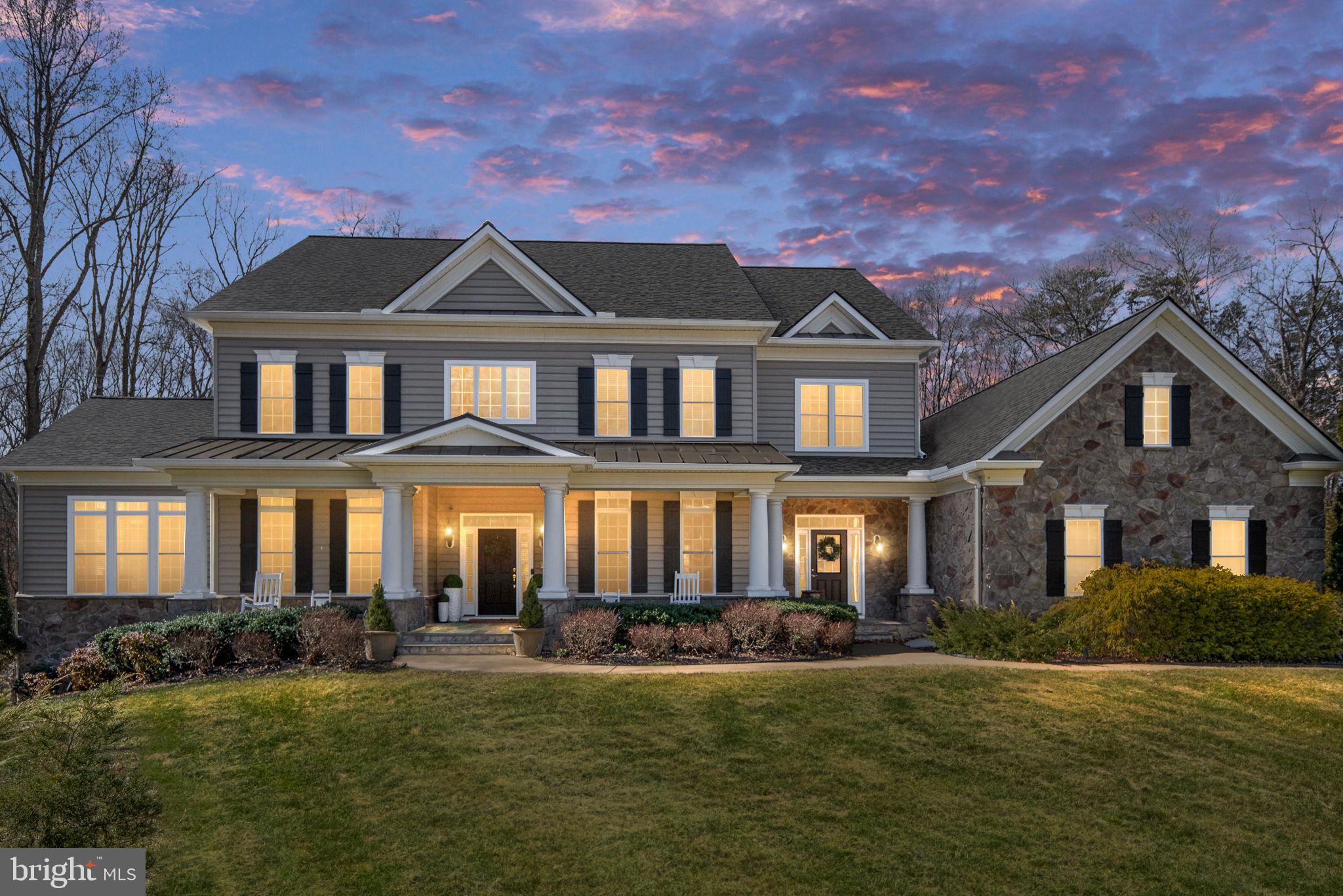 This exceptional estate is back on the market through no fault of the sellers, giving buyers a rare second chance to make this incredible luxury property their own. Don't miss this opportunity! 

This extraordinary private estate offers nearly 8,000 finished square feet of refined living on 4.5 serene acres — where luxury, privacy, and exceptional value come together.

From the moment you arrive, the inviting front porch sets the tone for this peaceful retreat, designed for quiet mornings and relaxed evenings surrounded by nature and privacy.

Inside, a grand foyer welcomes you with timeless character and impressive scale. Rich hardwood flooring flows throughout the main level, leading into a thoughtfully designed gourmet kitchen featuring gas cooking, granite countertops, built-in appliances, and beautifully appointed cabinetry. The adjacent sunroom, filled with natural light and finished with elegant tile flooring, creates the perfect setting for morning coffee or casual gatherings.

The family room is both warm and dramatic, anchored by a striking stone gas fireplace and expansive windows that flood the home with natural light.

A private main-level guest suite provides flexibility and convenience for visitors or multigenerational living.
Upstairs, you’ll find four generously sized secondary bedrooms, including a Jack-and-Jill bath, along with a luxurious primary suite designed as a true retreat. The primary suite features custom built-in his-and-hers closets and an atmosphere of comfort and sophistication.

The fully finished walk-out lower level expands the living experience even further. Designed for entertaining and relaxation, it includes a sixth bedroom, upgraded full bath, impressive bar area, expansive recreation and lounge spaces, and a dedicated theater room — ideal for hosting, game nights, or private movie screenings. 

Outside, the 4.5-acre setting provides exceptional privacy and endless possibilities to create your own outdoor oasis. The covered deck is enhanced with built-in surround sound speakers, creating the perfect backdrop for entertaining or unwinding in a peaceful setting.

Additional upgrades include a new roof, whole-house natural gas generator, whole-house water filtration system, and water softener system — offering peace of mind, efficiency, and comfort year-round. 

Ideally situated in the sought after Riverbend School District with convenient access to I-95, Quantico, Fort Belvoir, Washington, D.C., the VRE, shopping, and dining, this estate perfectly balances luxury living with commuter practicality.

For qualified buyers, sellers may consider contributing toward an interest rate buy-down with a strong offer and favorable terms — creating an opportunity for added monthly payment savings while securing this exceptional property.

This is more than a home — it’s a lifestyle.