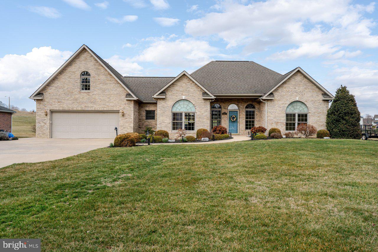 Situated along the 6th Green of Shenvalee Golf Resort, this thoughtfully designed home offers comfort, views, and quality features throughout. The Great Room features gleaming wood floors, wide crown molding, a 12' ceiling, gas fireplace w/marble surround, and large windows with remote-control blinds overlooking the golf course. The kitchen offers abundant cabinetry, a large pantry, and a premium Wolf gas range perfect for cooking enthusiasts. The open dining area has cathedral ceiling; the bright breakfast nook has golf course views. The spacious primary suite features 36"doorways, dual vanity, large walk-in shower w/grab bars, private water closet, and a huge walk-in closet. Laundry and a half bath are conveniently located nearby. A home office w/two desk areas opens to the patio. Two additional bedrooms and a full bath complete the main level. A bonus room above the garage offers flexible space for a 4th bedroom, craft room, or recreation area. Enjoy mountain and golf course views from the shaded patio. Additional features include an oversized garage wired for an EV charger, basement storage, generator hookup, and three heating zones. No steps at the front entrance or patio.