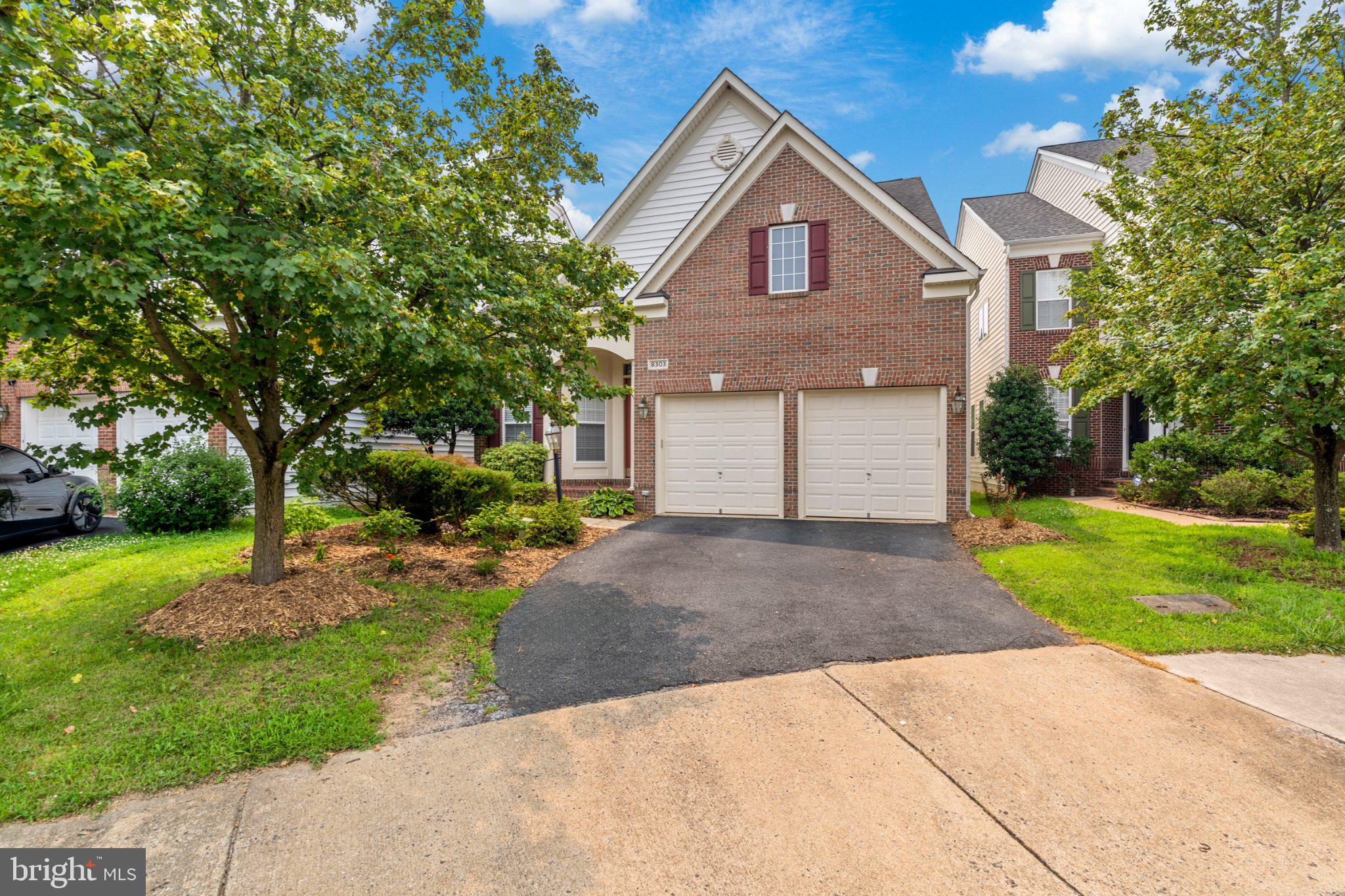 Welcome to 8303 Allerdale Court, a beautifully maintained brick-front home nestled on a quiet cul-de-sac in the highly sought-after Village at Lorton Valley. Offering 4 bedrooms, 4.5 bathrooms, and a versatile fifth flex room that can easily function as an additional bedroom, this thoughtfully designed residence combines elegant architecture with a highly functional floor plan.
The inviting two-story foyer welcomes you with hardwood flooring, decorative columns, and abundant natural light. The main level is designed for both everyday living and entertaining, featuring a private library, an elegant formal dining room with classic trim details, a spacious kitchen, an informal dining area, and a breathtaking two-story family room filled with natural light.
One of the home's most desirable features is the main-level primary suite, offering comfort and convenience with a spacious ensuite bath. The main level also includes a laundry room and a conveniently located powder room, creating the ease of main-level living.
Upstairs, the owner has thoughtfully enclosed the loft with double glass French doors, creating a versatile flex space overlooking the dramatic two-story family room below. Whether used as a fifth bedroom, media room, study, or playroom, this space offers privacy while maintaining an open architectural feel.
The finished walk-up lower level provides even more flexible living space, perfect for recreation, guests, hobbies, fitness, or entertaining.
Outside, you'll appreciate the home's established landscaping, which enhances its curb appeal and creates a welcoming first impression. A paved driveway leads to the two-car attached garage, providing ample parking and additional storage.
Enjoy all that Lorton Valley has to offer, including a community clubhouse, fitness center, outdoor pool, sports court, playgrounds, and access to over 10 miles of scenic walking, biking, and equestrian trails. Conveniently located just minutes from the VRE, Metro, major commuter routes, shopping, dining, and top-rated Fairfax County parks and amenities.