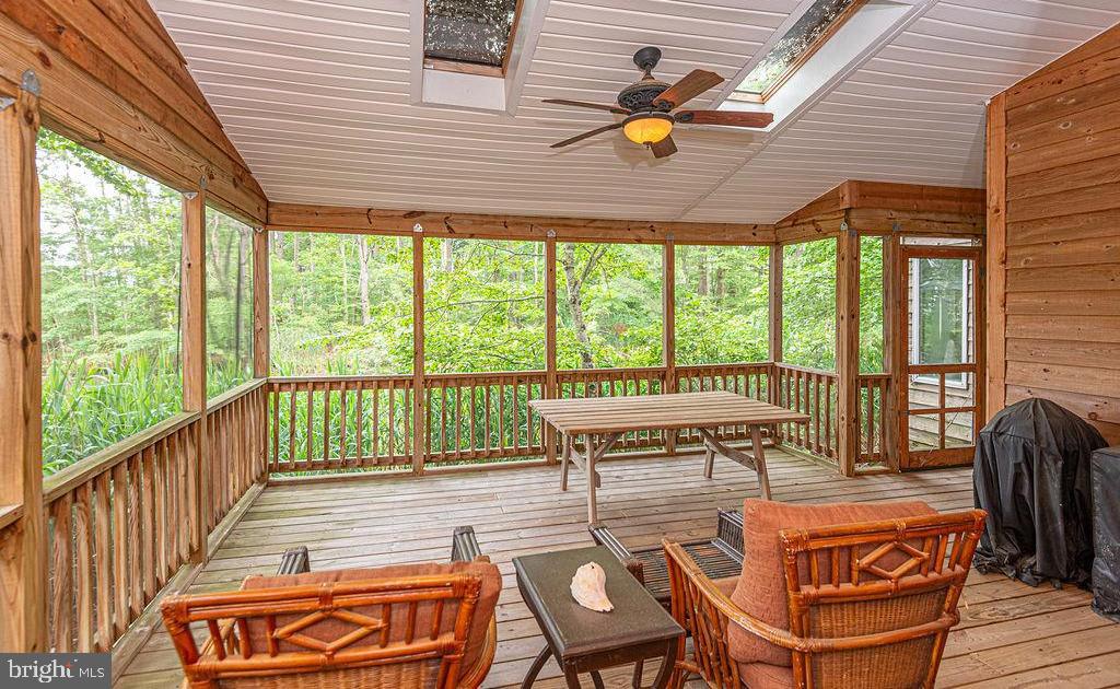 Tucked away on a quiet cul-de-sac in the amenity-rich community of Ocean Pines, this 3-bedroom, 2.5-bath  home offers comfortable coastal living with peaceful canal views and a flexible layout. The first-floor primary suite and living room both open directly to the screened porch, creating the perfect space to relax and enjoy the views.

The open main living area features a fireplace, skylights for abundant natural light, canal views, a convenient half bath, and plenty of closet space throughout. Upstairs are two additional bedrooms and a shared full bath. One bedroom is currently open to the living room below, creating a loft-style feel, but could easily be enclosed if desired. Both upstairs bedrooms offer private balcony access.

Recent updates include a roof replaced in 2023, HVAC system from 2021, and a brand new water heater scheduled to be installed next week. Enjoy waterfront living ideal for kayaks, paddleboards, and other small watercraft, all while being close to the pools, parks, golf, marina, beach club, and everything Ocean Pines has to offer.