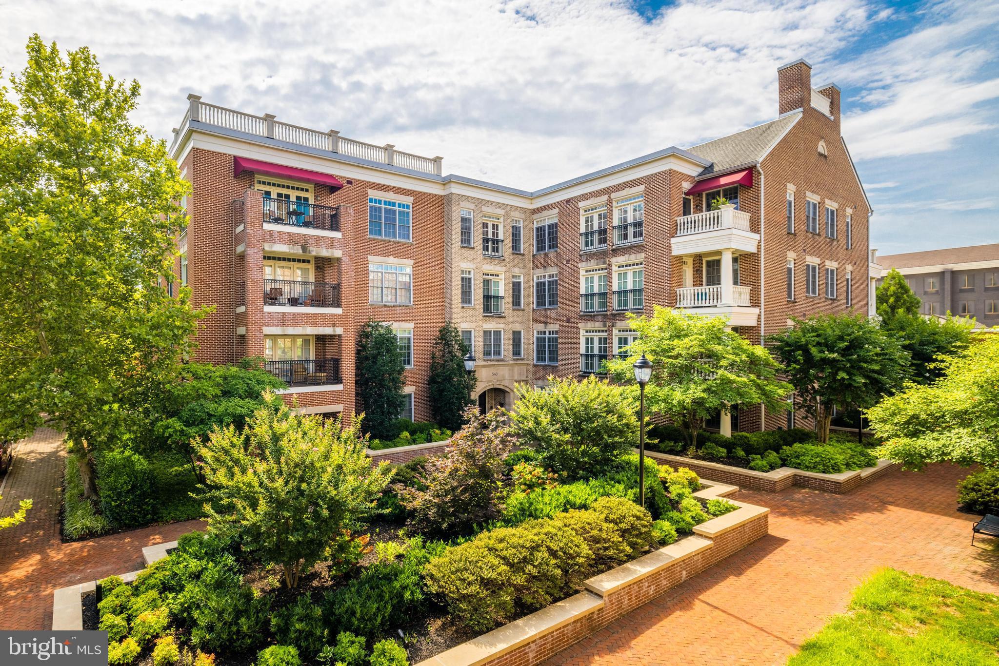 Luxurious Liberty Row condo in Old Town!  Rarely offered, the largest design on the top floor with 2,180 SF of pristine, bright and open living space.  Gleaming hardwood floors, brand new windows and balcony French doors.  Beautiful woodwork is found throughout with crown molding in Living room, Dining area, long hallway and primary bedroom. Gracious living room with much natural light features a gas fireplace and is open to lovely dining area with a stunning crystal chandelier.  Enormous eat-in kitchen with Viking stainless appliances and granite counter tops.  Spacious primary suite with a wide window accommodates a king size bed, space for a dresser, a sitting area plus the huge walk-in customized closet!  The adjoining primary bath features two vanities, a soaking tub and separate shower.  Two guest rooms are both sunny and inviting with large closets and many windows.  The laundry is found in the deep hallway with plenty of storage.  Two deeded garage parking spaces complete this fine residence.
