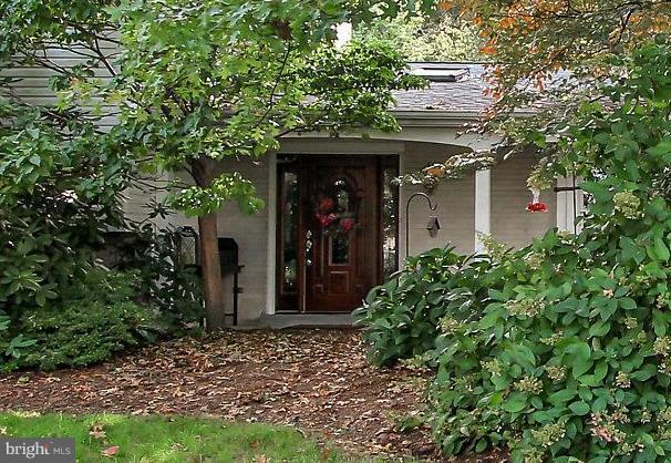 Living is easy in this impressive, spacious residence. Enjoy gatherings in the generously-sized living/dining/kitchen area graced by a glass stone, gas fireplace with tile surround. French doors lead out to your private getaway. Step down to your cozy den with two walls of windows, four skylights, a wood stove, and a cathedral ceiling flanked with wood-beam detail. The hallway leads you to a large bedroom and one of two offices. The office has a wall of windows plus skylights. Would make a great studio as well. Who doesn't love storage? Walk-in 5'x14' area for all those items you never have a place for. Well, now you do! As you venture down the set of stairs left of the entry, you will find a large family room with a lovely stacked-stone fireplace and dry bar. (Did someone say Man Cave?) There's a full bath with a walk-in shower. What person wouldn't love the spacious laundry room. A second office boasts a view of the pool as well as herringbone wood walls and two sliding glass doors. The stairs to the upper level take you to the second bedroom with lovely hardwood floors and a walk-in closet. The full bathroom features tile floors, a tile surround and a hand-crafted vanity. Ahhh, the Master Bedroom. Oversized to include a sitting area, the Master features sliding glass doors leading out to one of the decks, his and her closets, fresh carpet and a remodeled Master Bathroom. The Master Bath features a tile floor, granite countertop and a tile shower enclosure with seamless glass doors. All-in-all the home has a total of 14 skylights not to mention walls of windows that flood the home with natural light. Imagine entertaining friends and family in your backyard oasis featuring a 20'x40' Sylvan pool surrounded by a large patio and terraced gardens. Or curling up under your gazebo with a book or a cocktail after a long day's work. Take in the seemingly endless skyline views from any of your four levels of decking. Home features a 35-year architectural shingle roof. Located just two minutes from I-83, five blocks from York Suburban High School and six blocks from Valley View Elementary. Call to schedule your showing before this one gets away!