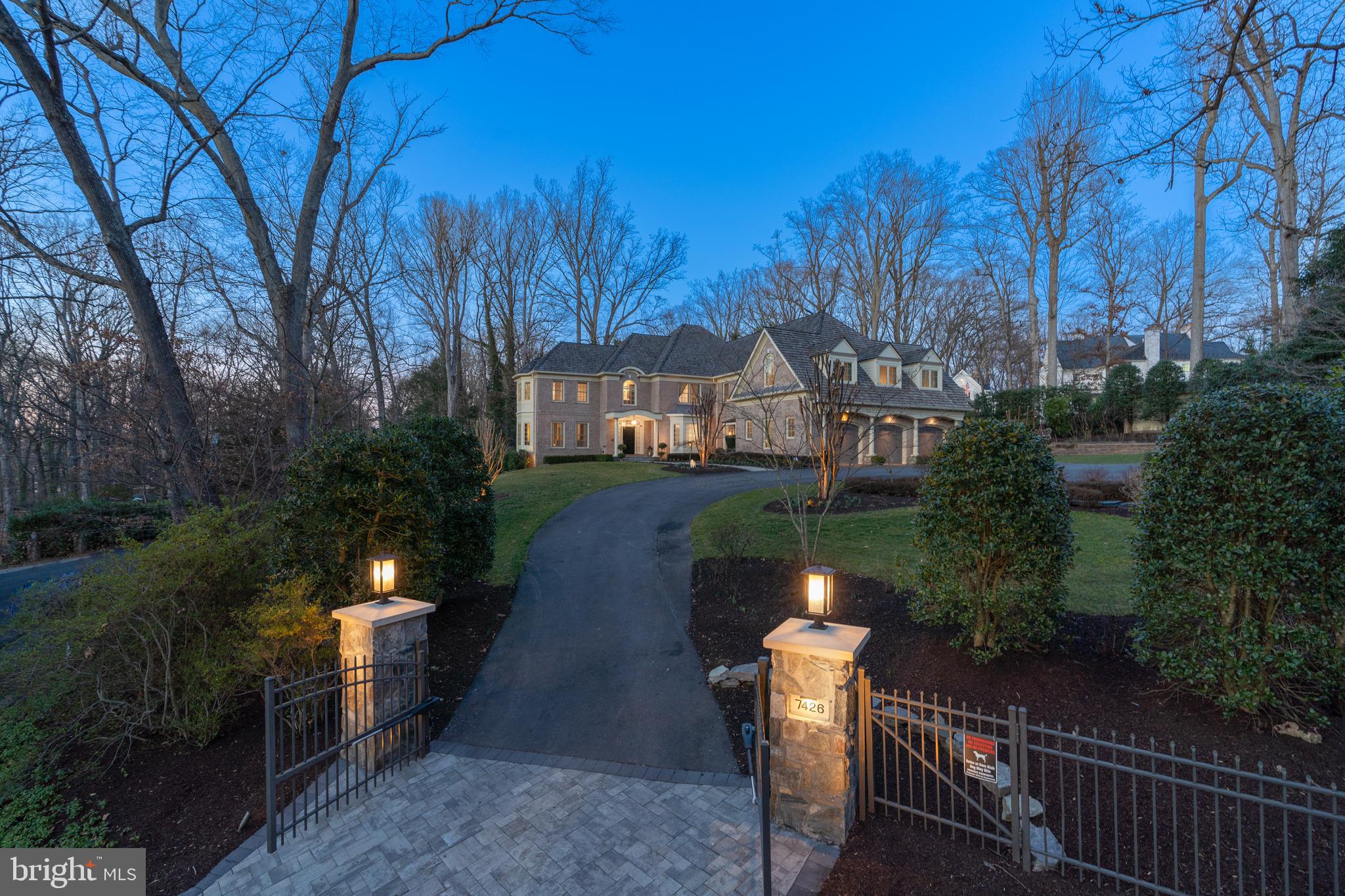 Exquisite brick colonial built by renowned builder Monarch Homes. Welcome to 7426 Dulany Dr, a distinguished gated estate nestled in the heart of McLean, Virginia. This exceptional residence goes beyond its secure gates and fully fenced perimeter to offer the epitome of luxury living, ensuring privacy and exclusivity for the discerning homeowner.

Approaching the property, the grand entrance gate unfolds to reveal a meticulously landscaped and fully fenced compound, establishing a serene retreat from the outside world.

Upon entering, you are immediately captivated by the seamless fusion of classic elegance and modern sophistication, highlighted by soaring ceilings throughout all three levels of the house. The inviting atmosphere is enhanced by high-end finishes, custom millwork, and an open-concept layout, with large windows framing views of the beautifully landscaped grounds.

The gourmet kitchen stands as a culinary masterpiece, showcasing top-of-the-line appliances, custom cabinetry, and a spacious marble island. Flowing effortlessly into the living and dining areas, this space is ideal for both everyday living and lavish entertaining.

The outdoor spaces of this residence are an extension of its grandeur, with the fully fenced backyard ensuring privacy and security, creating a tranquil oasis. Revel in the luxury of a generous patio for outdoor gatherings and lush landscaping, including a professionally designed garden featuring David Austin roses from England—a perfect balance of relaxation and sophistication.

The master suite serves as a haven of comfort, boasting a spacious layout, a spa-like ensuite bathroom, and ample closet space. Additional bedrooms and bathrooms are equally well-appointed, catering to the needs of both residents and guests.

This home is equipped with cutting-edge technology, featuring integrated security systems and lighting automation for ultimate convenience and peace of mind. The property also includes a spacious three-car garage and ample parking within the gated compound. The lower level adds an extra layer of luxury, with a professional gym, an elegant movie theater, and access to the yard, full-size bar, and entertainment area—a wonderful place for relaxation.

Located in McLean, residents of 7426 Dulany Dr enjoy easy access to upscale dining, premier shopping, and top-rated schools. Seamless commuting to Washington, D.C., and surrounding areas enhances the convenience of this luxurious residence.

Indulge in the epitome of refined living at 7426 Dulany Dr. Schedule your private tour to experience the unmatched luxury, privacy, and timeless charm that define this extraordinary McLean gated estate.
*** All the upscale furniture featured in the pictures is available for purchase, making this property a truly move-in-ready home.***