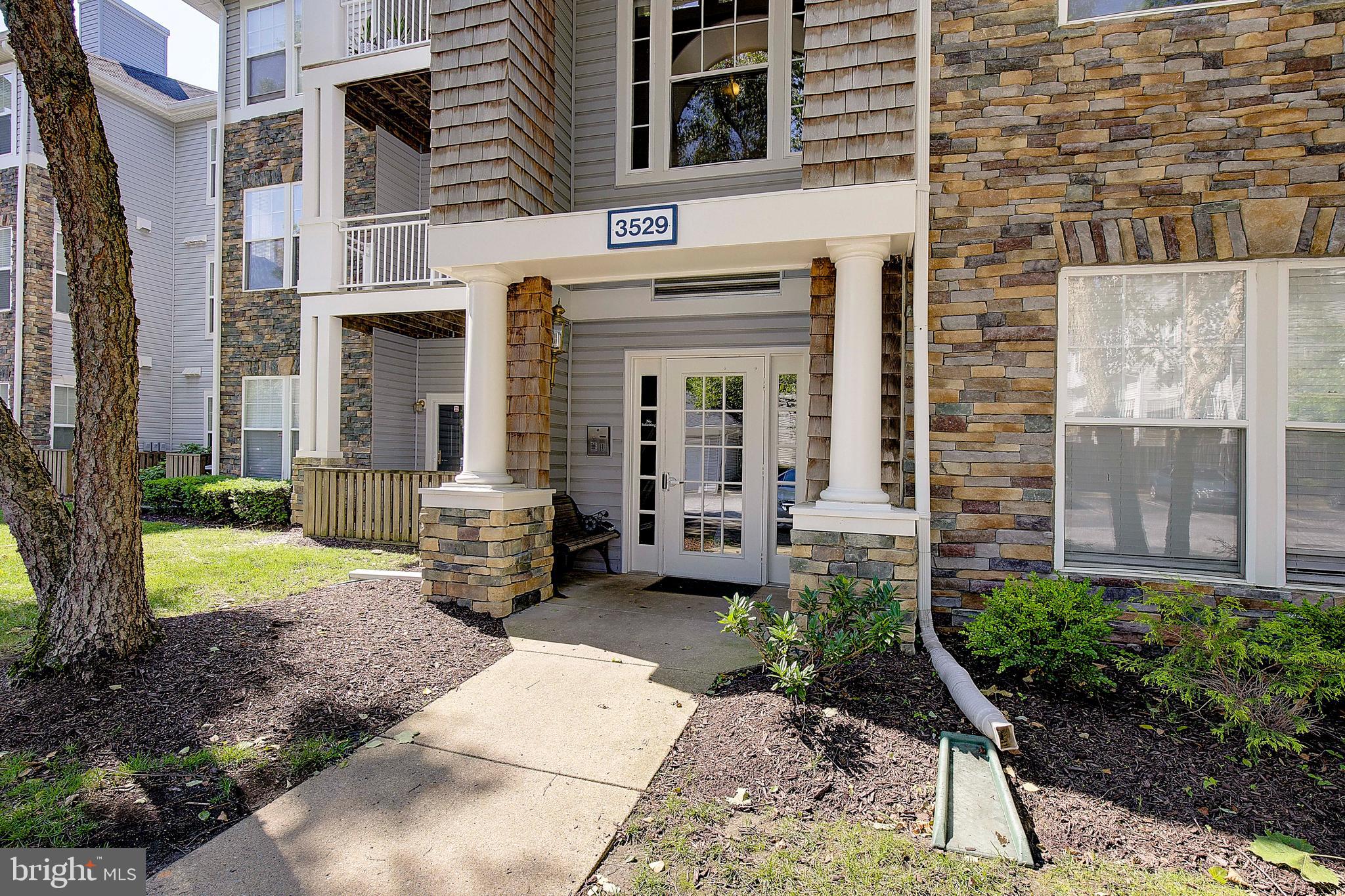 Just Listed and Ready for Its Next Owner! This meticulously maintained ground-level 2-bedroom, 2-bath condo in the highly sought-after Russett community offers the perfect combination of privacy, convenience, and comfort. Backing directly to peaceful woods, this extremely private unit provides serene views and a tranquil setting rarely found in condo living. With ground-level access and a recently renovated building featuring elevator service, this home is designed for easy, low-maintenance living.

Inside, you'll find a spacious and inviting living room with a cozy electric fireplace, perfect for relaxing evenings at home. The oversized primary suite features a large walk-in closet and private full bath, while the generously sized second bedroom is conveniently located near the second full bath ideal for guests, roommates, or a home office.

Additional highlights include a brand-new A/C unit and access to Russett's outstanding community amenities, including pools, parks, walking trails, tennis courts, and recreational areas. Conveniently located near major commuter routes, shopping, dining, and entertainment, this move-in-ready condo offers an exceptional lifestyle in an unbeatable location.

Freshly reintroduced to the market and ready for showings don't miss your opportunity to own this beautiful turnkey home in the heart of Russett!
