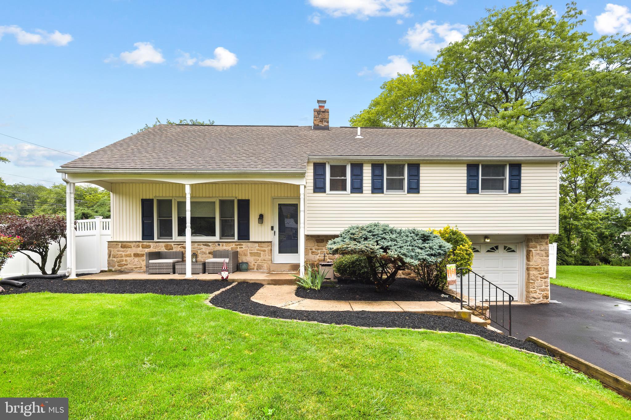 Welcome to 313 Upper Valley Road, a beautifully updated 4-bedroom single-family home in the highly desirable Merrybrook neighborhood. Set on over a quarter acre, this move-in ready property offers the perfect blend of timeless charm and modern upgrades. From the moment you arrive, the new extended driveway and pristine exterior set the tone. The home features a classic stone façade complemented by neutral siding, freshly painted shutters, and a newer roof, creating curb appeal that truly stands out. The attached one-car garage and oversized driveway provide parking for 4+ vehicles with ease. Step onto the covered front porch and into a bright, inviting living space. The main level showcases newer luxury vinyl plank flooring throughout, enhanced by recessed lighting in the spacious living room. The dining room is filled with natural light from two large windows overlooking the backyard, ideal for everyday living and entertaining. The fully renovated kitchen is a standout, featuring white cabinetry, granite countertops, stainless steel appliances (gas range, French-door refrigerator, and dishwasher), and a breakfast bar that seamlessly connects the kitchen and dining areas. Upstairs, all four bedrooms are thoughtfully laid out across the second and third levels. The primary suite offers generous space along with a private en-suite bathroom. Two additional bedrooms and a full hall bath complete the second level, while the third floor provides a versatile fourth bedroom, perfect for a home office, guest space, or flex room. The finished basement adds even more living space, ideal for a family room, home theater, or playroom. This level also includes a convenient half bath and laundry area. Out back, enjoy a covered slate patio overlooking the large, new fully fenced yard, perfect for summer entertaining, relaxing, or hosting BBQs. Located just minutes from SEPTA, major commuter routes, and a wide variety of shops and restaurants, this home offers both convenience and comfort. 313 Upper Valley Road checks every box- schedule your showing before it’s gone.