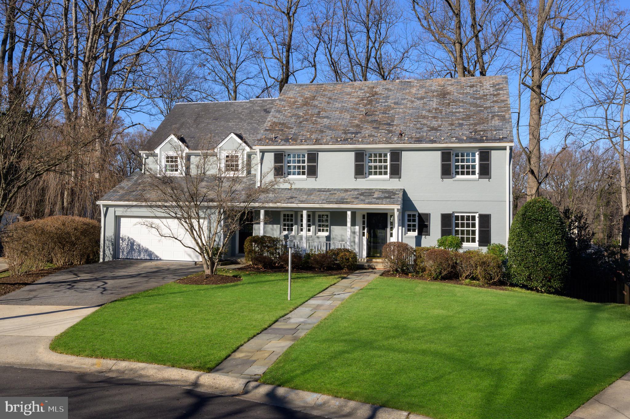 ***Offer due Monday February 5th at 3PM ***Nestled between Connecticut Avenue and East-West Highway, across from the prestigious Columbia Country Club, is The Hamlet. Developed by The Chevy Chase Land Company in the early 1900s, it represents one of the town's original, authentic neighborhoods with its winding streets and wooded lots. Situated at the end of a Cherry Blossom lined cul-de-sac against a verdant backdrop is 8120 Kerry Lane, a quintessential brick colonial fully reimagined and recently expanded. Once a traditional center hall floor plan, the home has been recently reconfigured to meet contemporary living while still exuding classic character. A private office with custom built-ins sits tucked away from the entrance. The foyer leads to an oversized formal living room with a fireplace, introducing one of the two gracious gathering hubs on the main level. A central sunroom at the home's rear affords both direct outdoor access and stunning exterior views. The combined living and dining rooms are fully open and anchor the informal living spaces, all flooded with natural light. Substantial in scale and meticulous in quality, the chef's kitchen features a full suite of Sub-Zero and Wolf appliances integrated within modern shaker cabinetry. A cozy breakfast nook and large mudroom off the attached two-car garage complete the main level. Upstairs, the primary suite provides a lavish retreat. A roaring gas fireplace establishes the ambiance, while the sumptuous ensuite bath is clad in Carrara marble, boasting luxurious accoutrements such as double vanities, a separate makeup counter, a freestanding soaking tub, and a walk-in glass shower. The private office space can be ideally used as a Peloton studio, yoga area, or reading nook. Two large dressing rooms, each with extensive built-ins and one featuring a center island complete the space. An additional on-suite and two secondary bedrooms sharing a hall bath are also found on this floor. An additional large bedroom with an accompanying full bath is located on the level above. 
The lower level presents a blend of practicality and entertainment, with a sixth-bedroom suite, spacious laundry room, and a walk-out recreation area. Twin-covered terraces and a screened porch enable all-season indoor/outdoor living. Out back, a spiral staircase descends from the deck onto an expansive patio. An artful combination of hardscaping, natural greenery, and total fenced-in privacy maximizes the home's large, lush lot. The new Chevy Chase Lake development, accessible to both the Beltway, DC line, and the award-winning Bethesda-Chevy Chase school cluster are all within mere minutes. 8120 is even situated optimally for the community's festive Fourth of July celebrations. Seamlessly blending today's conveniences with traditional charm in one of the area’s most sought-after neighborhoods, 8120 Kerry Lane offers a rare opportunity to experience the pinnacle of Chevy Chase living!