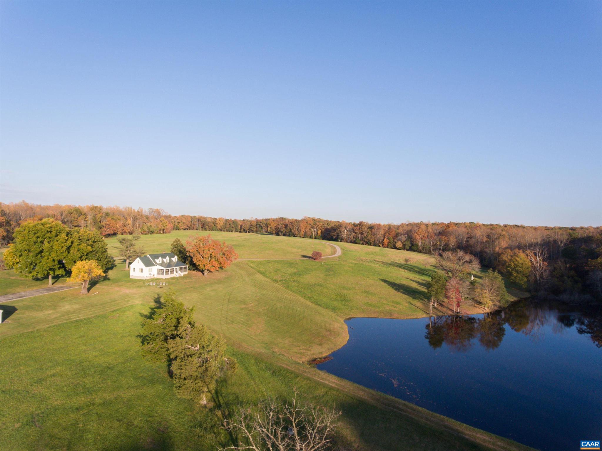 Haymaker Farm is the rare offering providing complete privacy, water views and a beautifully restored 18th century home, equidistance between Charlottesville and Richmond. Mature hardwoods open up to rolling fields and four beautiful ponds.  Abundant wildlife and natural beauty with miles of trails. The well proportioned 4/5 bedroom home has been meticulously restored and is ready as a primary residence or weekend getaway. Great proportions, beautiful porches with water views. Stable and farm buildings add to the meticulously maintained property.  Would make an excellent horse property with easy access to I-64 (three miles away) or as a cattle or working farm.  Endless possibilities.  Excellent candidate for conservation easement.,Glass Front Cabinets,Granite Counter,Marble Counter,White Cabinets,Wood Cabinets,Fireplace in Study/Library