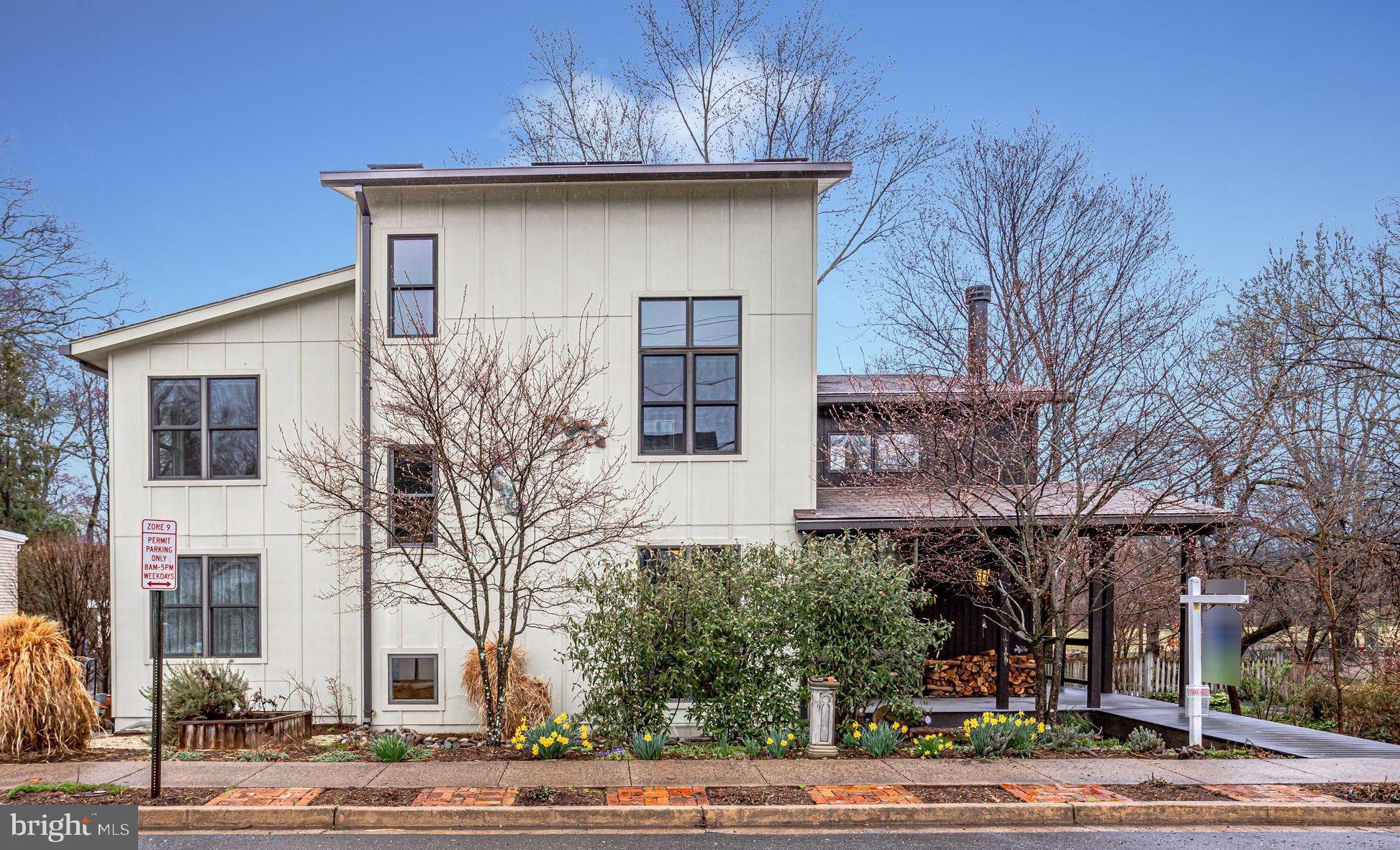 10 year young Modern masterpiece built by Coupard Architects.  Four levels of energy efficient living at its best. Enjoy low utility bills with Geo thermal and photovoltaic solar. Open floor plan with walls of windows capturing views of the lovely newly renovated Benjamin Banneker Park. Enjoy the living room with soaring two-story ceilings and reclaimed brick wood-burning fireplace.  Inviting open kitchen with spacious Cambria counters, SS Viking appliances, Built In Oven with warming drawer and microwave, pantry area with counters and wall of cabinets, a hidden butler's pantry (with more cabinets), a full closet pantry and a pleasant main level laundry room. Dining room area features built-ins with lighted glass cabinetry. Main level bedroom with gorgeous en suite bathroom, great potential for age in place. Go up the open staircase to a fabulous Master Suite that opens to views of the living room and walls of windows or shut the sliding wall of doors for a cozy retreat featuring a mini fridge for an evening glass of wine or a spot for morning coffee. Master also includes a walk in closet and luxury bath with jetted tub, walk-in multi shower system and double sinks. 2nd Level has another bedroom, full bath and wall of built in bookcases and storage cabinets. Up one more floor to a fantastic den with high ceilings and balcony over looking the trees and park. In the lowest level you will find a large Rec room with endless possibilities with its rough in for a kitchen and laundry giving it  potential for Au Pair, rental or family retreat. Featuring a 4th bedroom, full bath, separate entrance with walk up stairs and an abundant storage room with spacious built-in shelving and a work table too. Step outside to the wrap-around deck to enjoy nature and the professionally landscaped yard bursting with perennials, a River rock creek bed that slows roof rain water as it travels to two rain gardens, raised garden beds and permeable paver driveway with EV charger.  Walk to East Falls Church metro, the shops and restaurants on Westmoreland Street,  the W&OD trail steps away, Crossman Park and trail, and Benjamin Banneker Park and Dog Park. Floor plans and more photos coming soon.