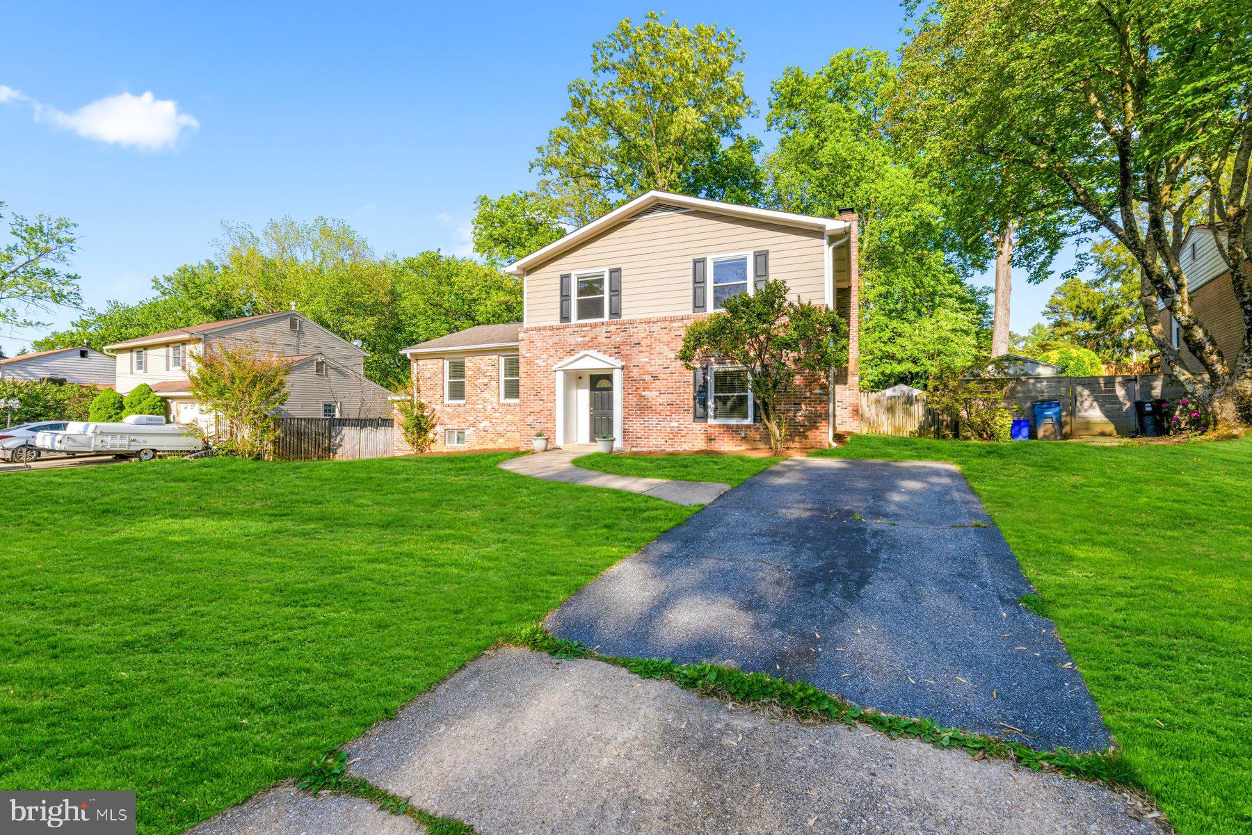 This beautifully reimagined four-level split features over 2900+ sf of luxury living space and offers the perfect blend of modern upgrades, thoughtful design, and everyday functionality. Featuring 5 bedrooms and 3.5 baths, the home has been completely renovated with a focus on quality craftsmanship and seamless indoor-outdoor living. The fully fenced rear yard is a true highlight—designed for entertaining and relaxation with a covered brick paver patio and added patio spanning the full length of the home, a large storage shed, and a custom-built playhouse. Off-street parking adds convenience, while the outdoor spaces create an inviting extension of the home’s living areas.

Inside, the main level showcases a stunning open-concept layout anchored by a gourmet chef’s kitchen, rebuilt from the ground up in 2023. Outfitted with quartz countertops, upgraded shaker-style soft-close cabinetry, stainless steel appliances, a custom tile backsplash, and built-in pantry, the kitchen flows effortlessly into the living and dining areas. A striking wood-burning fireplace with a floor-to-ceiling custom stone hearth serves as the focal point, complemented by newly installed ceramic tile flooring, modern recessed and pendant lighting, and a fully renovated powder room.

The upper levels provide exceptional flexibility and comfort and boast newly refinished, hardwood floors throughout. A private primary suite added in 2023 features vaulted ceilings, a spacious walk-in closet with custom built-ins, a dressing area, and a beautifully appointed en-suite bath with a dual vanity and a custom tiled walk-in shower. Four additional bedrooms—each with hardwood floors and updated lighting—offer generous space for family, guests, or home office needs. Two fully renovated bathrooms, including a guest suite with its own en-suite bath and walk-in closet, enhance both convenience and privacy.

The lower level adds even more versatility with an open area ideal for additional living, working or storage space along with a private walk-up entrance and recently updated full-size washer and dryer. Additional improvements throughout the home include replaced dual-pane windows and doors, updated recessed and decorative lighting, replaced vinyl siding, a newer roof (2011), and a brand-new water heater (2026). Ideally located less than a mile from the METRO Red Line, and just a block from parks and trails, this home offers unmatched accessibility to shopping, dining, the ICC, I-495, and major commuter routes, as well as easy access to Baltimore/Washington International Airport, Dulles International Airport, and Reagan National Airport—making it a truly exceptional offering in a prime location.....Welcome Home!