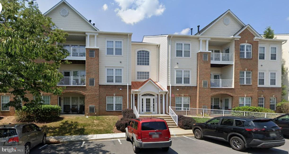 New carpet, home warranty and NO CITY TAXES!  Rare Opportunity in Spring Ridge with elevator access and a handicap ramp, this condo offers accessibility for all.   Don't miss this two-bedroom, two-bathroom condo in the highly desirable Spring Ridge community, offering a blend of comfort, convenience, and value. The open floor plan seamlessly connects living spaces, with a versatile den/office that could easily be transformed into a third bedroom.  Bedrooms are thoughtfully placed on opposite sides of the unit. Revel in the community amenities, including an outdoor pool, bike trail, clubhouse, community center, jog/walk paths, tennis/pickleball courts, and tot lots/playground. Backing to peaceful woods and green space, you'll enjoy a private, park-like setting.  Located close to shopping, restaurants, and major commuter routes, this is an investment in lifestyle and location.