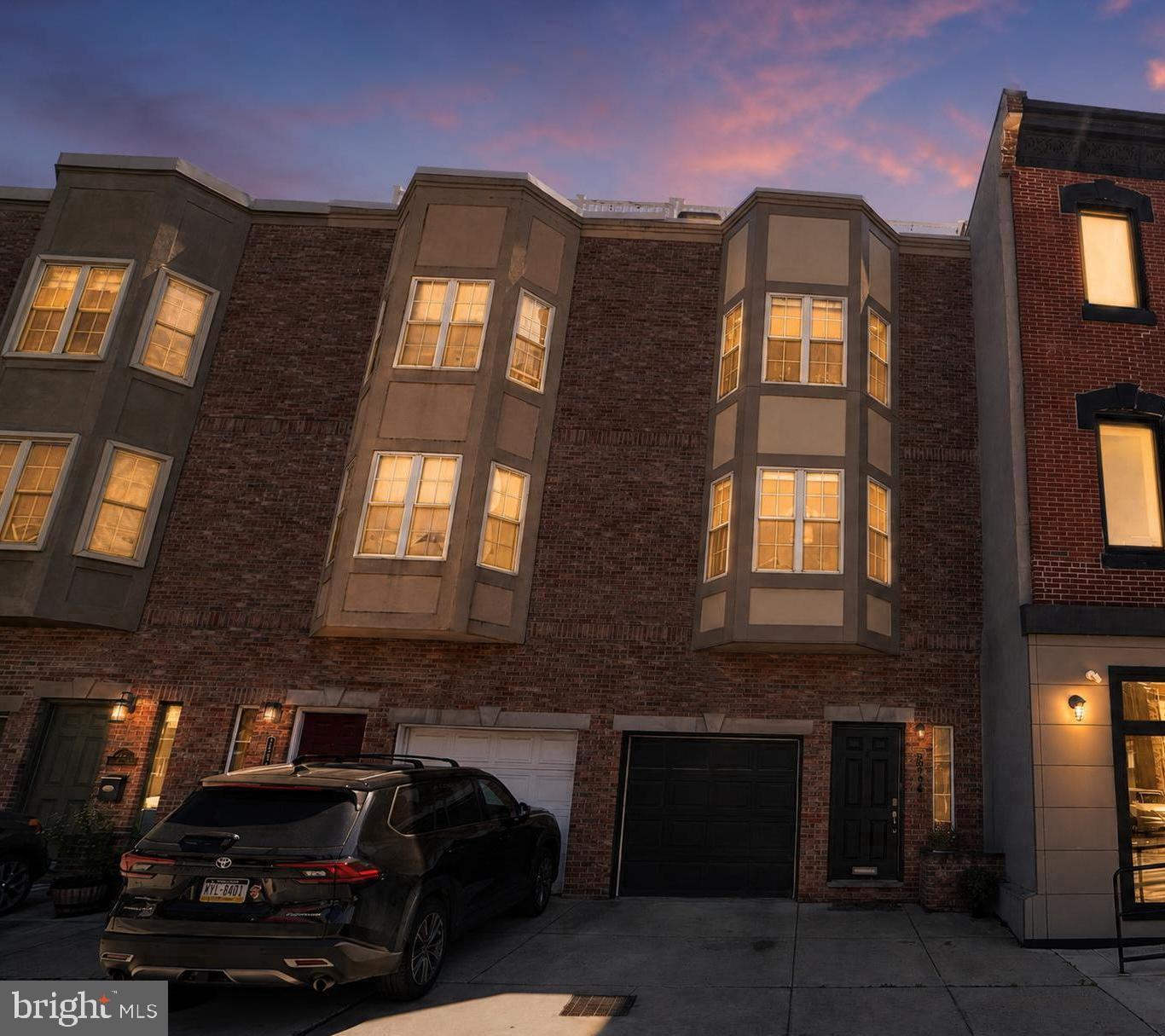 Welcome to 2246 Christian Street, an exceptional 18-foot-wide home in the heart of Graduate Hospital offering space, convenience, and rare city living. With four bedrooms plus a finished basement with egress offering potential for a fifth bedroom, 2.5 baths, multiple outdoor living spaces, high ceilings throughout, and parking for up to three vehicles, this home checks every box.
A welcoming foyer with coat closet and direct garage access opens to a bright, open main level featuring hardwood floors, high ceilings, and a wall of south-facing windows. The open layout connects the living, dining, and kitchen areas for easy everyday living and entertaining. A convenient powder room is located just off the kitchen.
The kitchen features granite countertops, stainless steel appliances, abundant cabinetry, an updated backsplash, under-cabinet lighting, and a large center island. The rear outdoor space extends off the main level, perfect for grilling, dining, and relaxing.
This home features abundant closet space, excellent storage throughout, and well-defined spaces that offer flexibility for everyday living.
The second floor offers three spacious bedrooms, a full hall bath, and an oversized laundry room. The finished lower level with egress provides flexible space for a media room, gym, office, playroom, or potential fifth bedroom suite.
The entire third floor is a primary suite retreat with high ceilings, a generous walk-in closet, and an en-suite bath with a double vanity and oversized walk-in tiled shower.
The bi-level Trex roof deck is a standout feature with unobstructed panoramic skyline views, solar lighting, water access, a newer pergola, and a dedicated landing area ideal for a future wet bar, creating seamless indoor-outdoor entertaining.
Major upgrades include stucco remediation with replacement using Hardie board siding to the front bay windows, roof replacement, Trex rooftop deck construction, dual-zone HVAC, tankless water heater, EV charging with 240V service, updated garage door system, and kitchen improvements.
Located in Graduate Hospital, enjoy walkable access to parks, playgrounds, dining, cafes, groceries, the Schuylkill River Trail, Penn, CHOP, Center City, and major highways.
A rare opportunity combining space, parking, outdoor living, and location in one of Philadelphia’s most desirable neighborhoods.