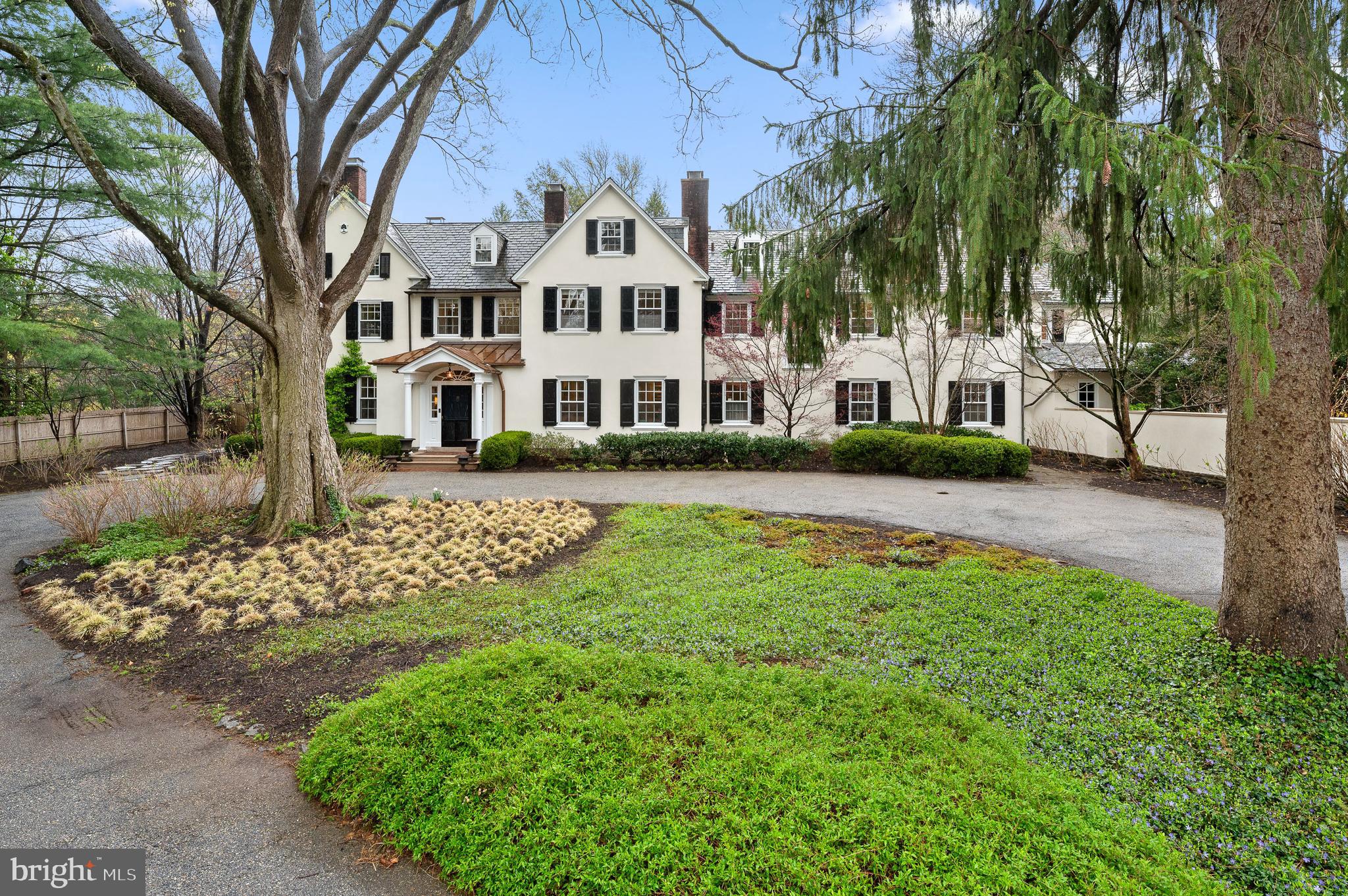 Elegance and Meticulous Craftsmanship of Yesteryear define this Truly Beautiful Property. This cherished home, with original build dating back to 1850, is one of the finest examples of gracious design with bygone era quality.  As you enter this spacious property offering a circular drive, specimen plantings, mature shade trees, stunning views and gardens, you are captured by the Grandeur. Upon entering this inviting home, you are greeted by a truly special Entrance Foyer with Fireplace, incredible Original Millwork and Soaring Staircase with Landing overlooking beautiful Terrace and Gardens. The First level provides comfortable living with open areas yet exquisite charm through thoughtful architecture. A formal Living Room with Original Fireplace, French Doors to the terrace and full corner exposure-simply lovely; the Formal Dining Room complements the Living Room with a traditional “walk-through Foyer” for full enjoyment of this home; a warm and welcoming Library to the right of the Foyer with Fireplace and Formal Powder Room tucked away for guests-just perfect; the Traditional Hallway with arched Doorway leads to the Heart of the Home with Welcoming Kitchen, Living Area, Informal Powder Room, Gorgeous Sun-drenched Breakfast Area with corner exposure providing breathtaking views of Manicured Gardens and Perfectly
sized Pool for delightful Summer Enjoyment along with Level Play Field! The Second Level features a full Primary Suite running front to back with maximum Sunlight and Cross Breeze; the Primary Suite also features Custom Cabinetry Walk-in Closet and Completely Renovated Full Bath-not to be missed; an 
 Expansive Hall provides entrée to Four Additional Bedrooms-Two Ensuite with Newly Renovated Full Baths, Two sharing a Fully Renovated Hall Bath, a Study Space perfect for quiet time, and the Most
Important- a Full Laundry and Walk-in Original Linen Press. The Third Level offers four additional Bedrooms, Office, and Full Bath- the Perfect Suite for Guests. The thoughtfully designed Exterior of this Property provides the very best in year-round Entertaining with Gorgeous Pool, Terraces, Stepping Stone Pathway, Vegetable Garden, Seasonal Storage Structure and more. The Original Carriage House is an
Architectural Dream from another time- Not to be Missed! Convenient to all Shopping, Dining, Lower Merion Schools – this is the one you have been waiting to see!
NB  The Carriage House and a small part of the Main House were built in 1850 with the majority of the house  was built in 1930/31.  We have the original plans available for review .