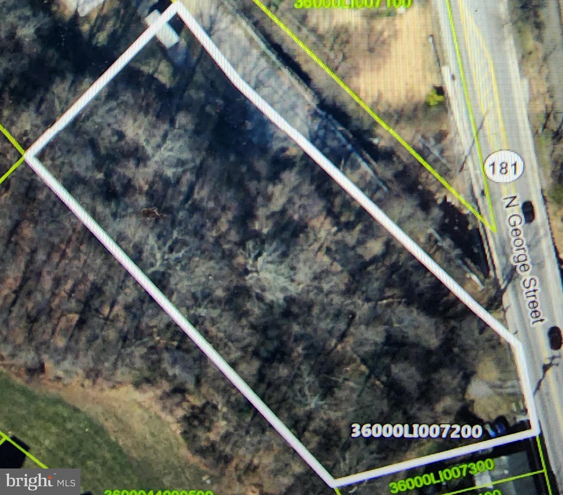 This is an estate sale. The lot is wooded and is income producing. The Lamar Companies, leases a billboard on the property. The annual net income, to the landowner, is $2,500.00.  This lot is zoned Office on the front half and Residential High on the back half. Interested Buyers are encouraged to contact the Manchester Township Zoning Officer to discuss zoning and rezoning possibilities.