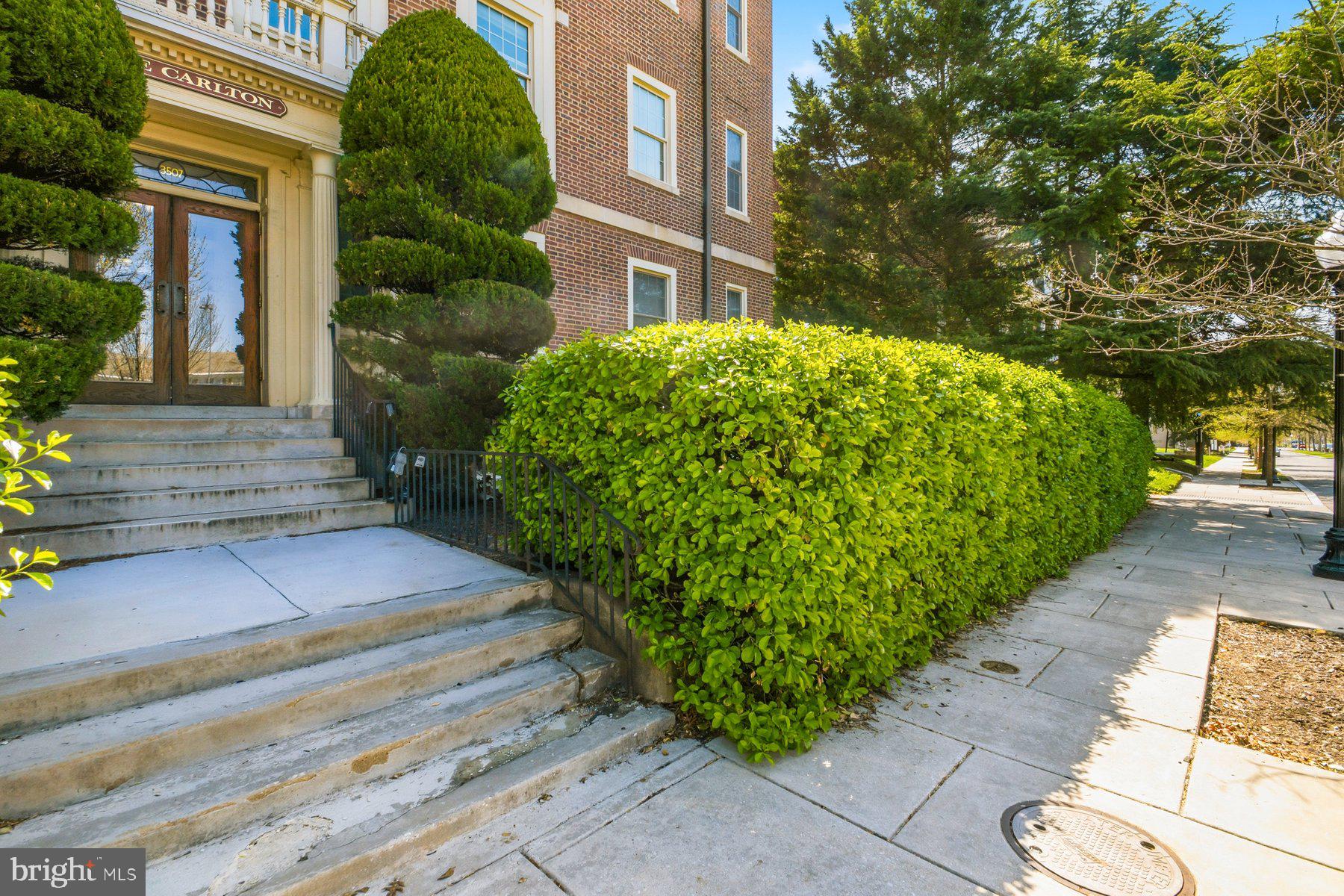 Situated on the third floor of The Carlton, this 3-bedroom, 1-bath residence offers a blend of classic charm and everyday practicality in a prime location just moments from Johns Hopkins University. This 1300 s.f. apartment in this grand Georgian Colonial with many of the original features still intact,  Heat and water included in your condo fee. The kitchen is renovated with granite countertops with the original butlers pantry adding charm.  Oak floors, high ceilings and an ornamental fireplace make this pleasant unit warm and elegant. Extra storage in lower level as well as the laundry room. Come enjoy the vitality of city living and the elegance of 1916 architecture. Window air conditioning units provide seasonal comfort. Ideally positioned for easy access to Charles Village shops, dining, and green spaces, this home offers a comfortable city lifestyle with enduring architectural appeal.