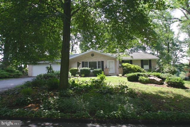 Brick ranch on beautiful wooded lot! replacement windows, all appliances stay, home warranty for peace of mind!Backs to preserved farm land. over sized 2 car garage w-storage.