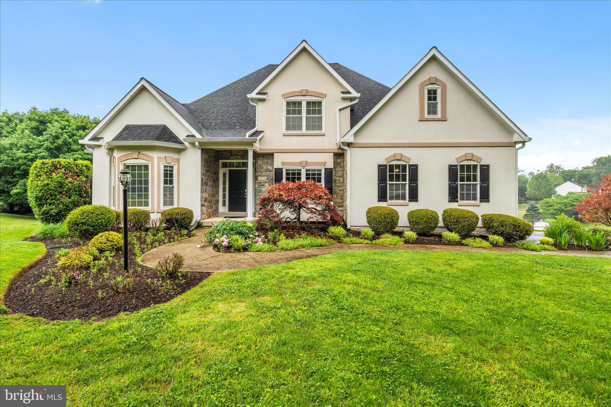 Absolutely stunning and meticulously maintained, this spectacular 5-bedroom, 3.5 bath colonial in the sought-after Woodfield Estates community sits on 1.35 private acres engulfed by mature trees, with spectacular in-ground pool and backing to open space! Beautiful hardwood floors welcome you into an elegant main level featuring entry-level primary suite. The primary suite on the main level is a focal point, with views of the pool and gorgeous en-suite bath. The main level is exceptional with two-story family room, flanked by a striking stone fireplace. Additionally, you have a formal dining room, living room and an open-concept eat-in kitchen. The kitchen has updated appliances and leads nicely to your freshly painted deck. Additional main level features are laundry room, and powder room. Upstairs you'll find four additional generously sized bedrooms and a full bath with double vanity. The finished lower level delivers incredible flex space with a living area, fully equipped gym, and full bath. There is a legal bedroom/guest room for guests enjoying your pool. Outside, the deck overlooks a well maintained inground pool with new filter, pump, salt system, and salt cell. Enjoy your own private oasis surrounded by lush mature trees. Major upgrades include a new roof, new electric water heater, new heat pump for second floor, whole-house electrical upgraded to 400 amps, and two EV chargers in the garage plus an exterior EV charger plug. All of this with an extremely low HOA(common grounds only) in one of Montgomery County's most serene and peaceful neighborhoods, with easy access to MD-124 connecting to I-270 and MD-355 for an effortless commute to Washington, DC, Rockville, and beyond. Schedule your private showing today!