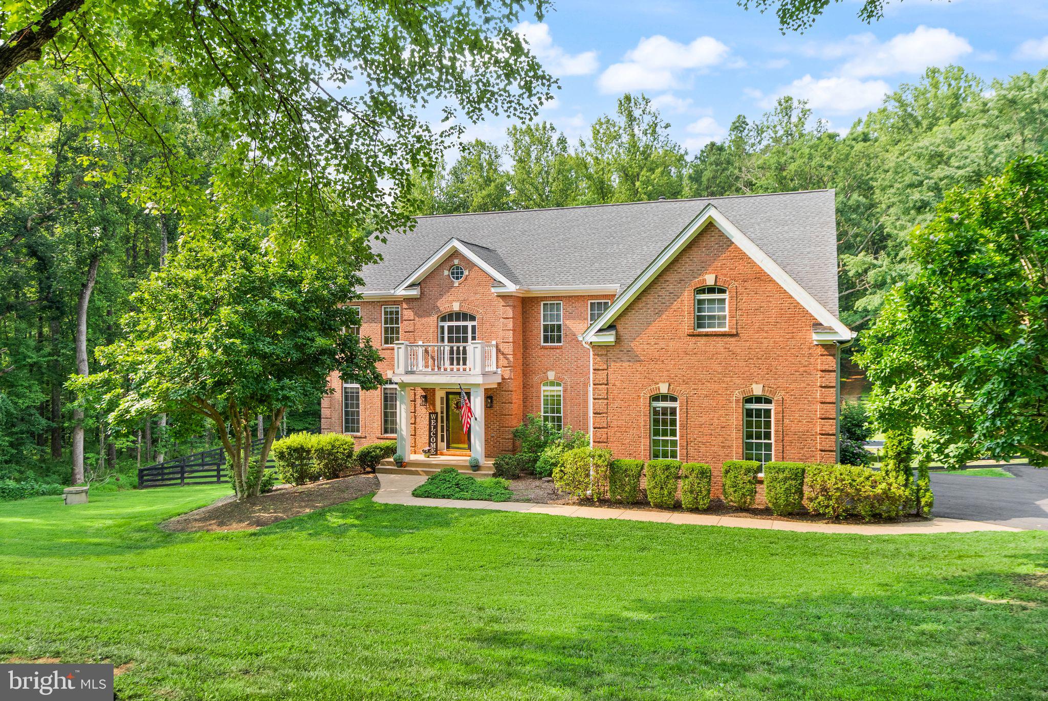 Nestled within the private enclave of Evergreen Forest, this exquisite traditional residence offers an unparalleled blend of luxury and comfort, set against a backdrop of nature's beauty. Spanning an impressive 5,591 square feet, this home is a sanctuary of sophistication, boasting five spacious bedrooms and four and a half elegantly appointed bathrooms. Step inside to discover a harmonious open floor plan that invites both relaxation and entertaining. The heart of the home is the gourmet kitchen, featuring high-end stainless steel appliances, including a new double oven, quartz counters, updated cabinets, gas cooktop with downdraft ventilation and wine fridge.  The expansive island serves as a focal point for culinary creativity, and eat-in options for casual dining. The family room, seamlessly connected to the kitchen, is adorned with Sky high ceilings, and wood burning fireplace which offers a warm ambiance, perfect for group gatherings.  Private office or kids retreat, a well aquatinted formal living room and formal dining space complete the main floor. Retreat up stairs to the oversized primary suite, a true oasis, complete with a luxurious en-suite bathroom featuring a jetted tub and a walk-in shower, ensuring a spa-like experience, a very large walk in closet has additional hidden storage for all your wardrobe needs. Thoughtful details such as chair railings and wainscoting throughout the home add a touch of elegance. The fully finished walkout basement has been updated new flooring, paint and an expansive top of the line bar complete with built in fridges, dishwasher, built in ice machine, sink and and kegerator. The 5th bedroom and full bath provide an additional living space, ideal for a media room, game area and gym along with extra storage. The exterior of this property is equally captivating, set on a sprawling 4.44-acre lot that backs to lush trees and features a picturesque stream. This tranquil setting offers a rare opportunity to enjoy rural living while being just moments away from modern conveniences. The cleared areas provide ample fenced in space for outdoor activities or potential landscaping projects, allowing you to create your own private retreat. Parking is a breeze with a side-entry, three-car garage, ensuring convenience and accessibility. This home is not just a residence; it's a lifestyle choice that embodies luxury, comfort, and the beauty of nature. Experience the perfect blend of elegance and tranquility in this remarkable property, where every detail has been meticulously crafted to enhance your living experience. Embrace the exclusive lifestyle that awaits you in Evergreen Forest.  More photos coming soon.