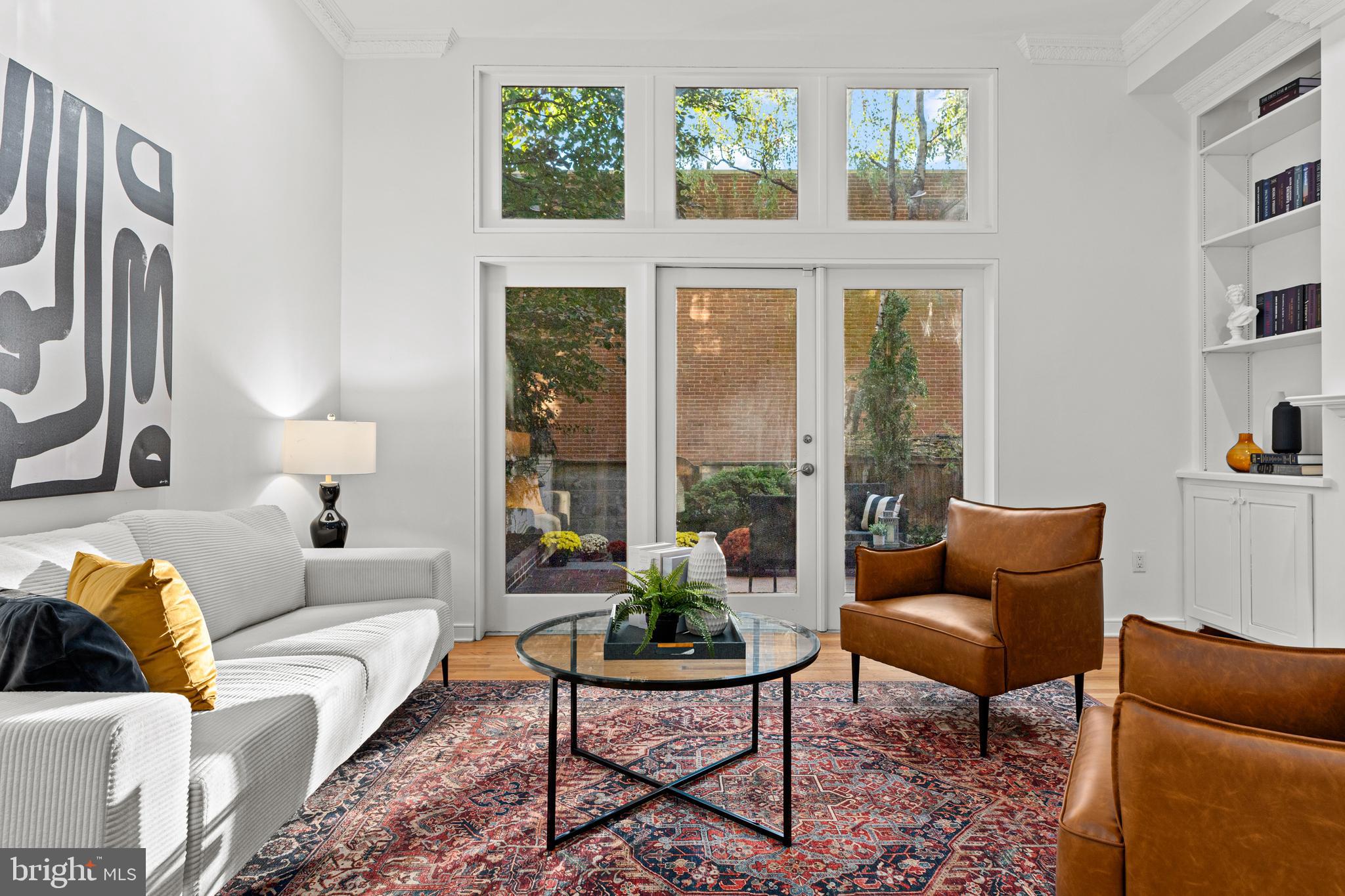 Embrace the best of city living in this beautifully updated townhome, perfectly situated in the heart of historic Philadelphia.

Nestled within the serene, cobblestone courtyard of Lawrence Court in Society Hill, this stunning townhome offers a unique blend of historic neighborhood charm and modern luxury. Step inside to discover a bright and airy foyer leading to a versatile den and office space, a powder room, and a separate laundry room. Ascend to the second level and be captivated by the spacious sun-drenched living room, complete with a wood-burning fireplace and custom built-ins. French doors open to your private brick garden oasis, creating a seamless indoor/outdoor flow and extending your living space in the warmer months. Imagine enjoying morning coffee or evening cocktails surrounded by lush greenery in your own personal sanctuary. It's also a wonderful space to entertain family and friends. There's even a covered shed that can be used for storage or as a potting shed, and a rear access door leads you to your dedicated parking space. The gourmet eat-in kitchen is a chef's dream, featuring high-end appliances such as a Viking gas range and refrigerator, abundant cabinet space, and picturesque courtyard views from the dining area.

The third-floor hosts two generously sized bedrooms with ample closet space and a full bathroom with a tub. Retreat to the luxurious primary suite on the fourth floor, where you'll find custom closets, built-ins, and a spa-like marble bath with a unique and functional layout featuring dual sinks and toilets sharing a shower that is separated from each side by a pocket door.  

This rarely available residence boasts hardwood floors, fantastic natural light, dual-zone HVAC, a new roof, and 1-car deeded parking, a rare luxury in this coveted neighborhood. It's also been freshly painted, so all you need to do is turn the key and move on in.

Now let's talk about the neighborhood. Enjoy the ultimate walkable lifestyle with easy access to Headhouse Square Market, South Street, Old City, Penn's Landing, Spruce Street Harbor Park, Washington Square Park, and more. Everyday conveniences are just steps away, with a variety of grocery stores, shops, and restaurants within easy reach. This home is located within the catchment area for General George A. McCall School. It's also conveniently located near the bridges, I-95 and I-676 for effortless commuting to enjoy life's adventures. What are you waiting for? Make your appointment to see this fantastic home today!

Important Disclaimer: School catchment areas can change. It is always recommended to confirm the current school boundaries with the school district directly.  One of the sellers is a Licensed PA & NJ Real Estate Professional.