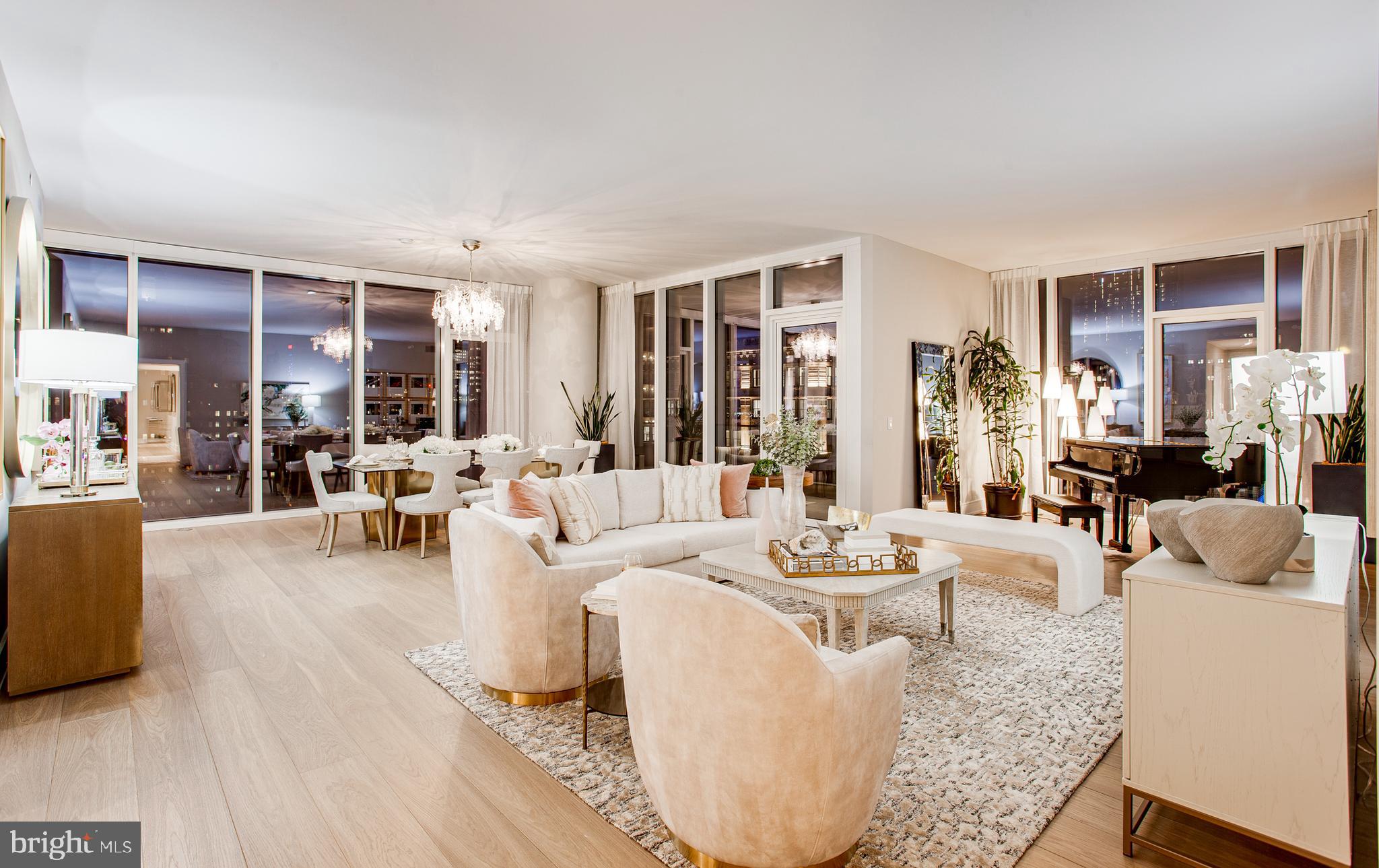 Arthaus, a commanding new residential high-rise in Philadelphia’s vibrant performing arts district, proudly presents Unit 2501—a spectacular single-level residence offering 2,880 square feet, three bedrooms, and three-and-a-half baths, priced at $2,845,000. With sweeping views of City Hall, the Center City skyline, and the river, this home delivers an extraordinary living experience high above Broad Street.

This maintenance-free, move-in-ready residence showcases sophisticated interior design, resort-style amenities, and impeccable white-glove services. A tax abatement enhances its long-term value. Whether you’re a busy professional, discerning retiree, or global traveler, Residence 2501 is truly a must-see.

From the moment you enter, Arthaus makes a lasting impression. A tall, solid wood entry door with elegant hardware opens into a spacious, light-filled foyer. To the left, the grand salon unfolds—a stunning contemporary living and dining space ideal for both entertaining and everyday living. Two full walls of floor-to-ceiling windows frame mesmerizing city and skyline views, while soaring ceilings and continuous wide-plank Havwoods hardwood flooring in Fendi create an atmosphere that is bright, airy, and expansive. An inset, weather-protected balcony extends from the living area, overlooking Broad Street—an ideal perch for relaxing at day’s end.

Tucked discreetly away is a professional chef’s kitchen designed for hosting with ease. The U-shaped layout provides seating for four at the counter, with additional space for a breakfast table. Silver ash Poggenpohl cabinetry pairs beautifully with Golden Gate quartz countertops and a matching backsplash, delivering a clean, refined aesthetic. The premium stainless-steel appliance suite includes Wolf, Sub-Zero, Bosch, and Asko, with fully integrated door fronts for a seamless, custom look.

The private bedroom wing is located to the right of the foyer on the north side of the residence. The first guest bedroom features striking City Hall views, an ensuite bath, and a walk-in closet—perfect as a guest suite or home office. The second guest bedroom offers a generous closet, an ensuite bath, and tranquil Center City skyline views. Both guest bathrooms are finished with porcelain Calacatta tile floors, super white quartz countertops, and polar white matte Poggenpohl cabinetry.

The spacious owner’s suite is a serene retreat, featuring an oversized walk-in closet and 10’ floor-to-ceiling windows with dramatic skyline vistas. A private balcony brings the beauty of the Delaware River into full view. The spa-inspired primary bath is exquisitely appointed with a Badeloft soaking tub, double vanity with Robern mirrors, super white quartz marble countertops, Contempo white marble floors and shower tile, and a private Kohler water closet—delivering a truly best-in-class experience.

Arthaus is a modern architectural masterpiece developed by Carl Dranoff, designed by world-renowned firm Kohn Pedersen Fox, and built by Intech Construction. The building places wellness at its core, from the stunning Monet-inspired mosaic lobby to the private resort spanning the 6th and 7th floors. Amenities include a pool, state-of-the-art fitness center, spa, salon, pet park, outdoor terraces, lawns, and gardens. White-glove services include a 24-hour doorman, concierge, chauffeured town car, and valet parking.

This residence includes one licensed parking space. With the tax abatement, annual real estate taxes are approximately $5,447.