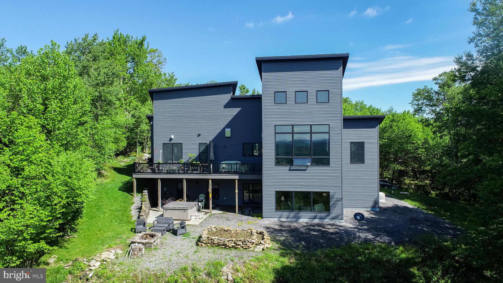 One in a lifetime opportunity to own one of Maryland’s most distinctive homes. Built in 2019, this fully custom modern home is located on the highest elevation building lot in the state of Maryland, making it the highest elevation home in the state at our 3300 feet above sea level.  Designed to take full advantage of the setting, the property offers incredible panoramic views stretching across the rolling hills of Western Maryland and West Virginia looking out towards Canaan Valley and Timberline Resorts. The home features clean modern design, high-quality craftsmanship, and a private mountain setting unlike anything else on the East Coast. Tall ceilings provide a grand feel throughout the entire home. Equipped with a backup generator for the harshest of weather conditions.  Within 25 minutes to Thomas/Davis, WV and Oakland, MD. Whether you are an avid outdoor enthusiast looking to capture all that the resort towns have to offer close by or simply looking for one of the best views on the East Coast, this home is sure to check many of the best boxes. Don't miss this rare opportunity to own a truly one-of-a-kind property in the mountains of Garrett County, MD. Call today!