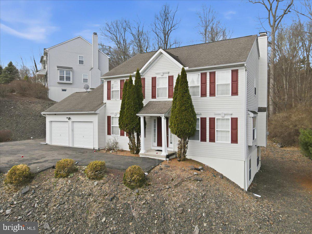 Welcome to your ideal retreat in the heart of the Poconos, located in the Country Club of the Poconos and within the East Stroudsburg School District. This 4-bedroom, 2 full and 1 half bath home offers the perfect blend of space, comfort, and low-maintenance living--ideal for a primary residence, vacation home, or investment property. Inside, you'll find a bright, functional layout designed for both everyday living and entertaining. Natural light fills the main living areas, creating a warm and inviting atmosphere throughout. The unfinished 1,256 sq ft walk-out basement provides exceptional potential--perfect for a future game room, family room, home theater, gym, or any space that fits your needs. It's a blank canvas ready to expand your living area and add value. Outside, enjoy a zero-maintenance yard, giving you more time to relax and enjoy the surrounding area without the upkeep. Minutes to Great Bear Golf Club, Shawnee Mountain Ski Area, and Shawnee Inn and Golf Resort, with quick access to Route 80, this location puts you at the center of year-round recreation including skiing, golf, hiking, and river activities, while also offering an easy commute to New Jersey and beyond. Whether you're looking for a full-time home, weekend escape, or income-producing property, this home offers flexibility and convenience in one of the Poconos' most well-known communities. *Some Images are Virtually staged*
