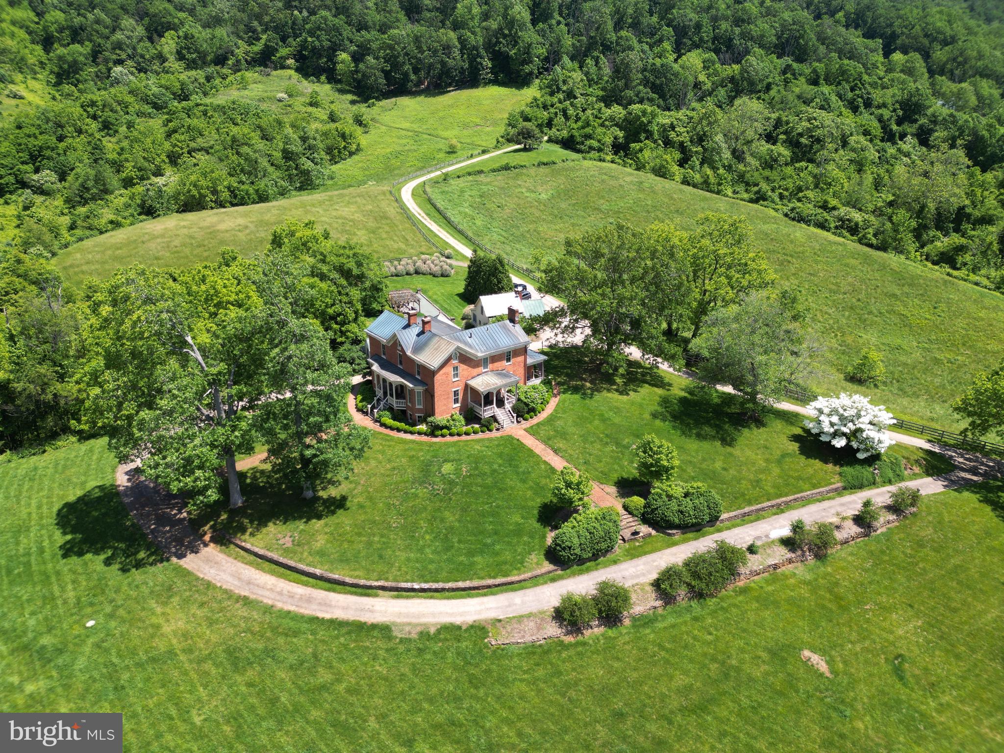 Historic Inn for sale in Sperryville, Virginia

Unique Opportunity
Experience the serenity and breathtaking scenic views of rolling foothills and grazing pastures with this exceptional opportunity in Sperryville, Virginia. This residence, with a rich history dating back to the 1820s, has been meticulously preserved for generations. For the past 12 years, the owners have shared this extraordinary home as a popular inn. Now, it is available for sale as either a full-time residence or a continuing inn/bed and breakfast business.

Property Overview
Perched atop a hill, this historic inn offers panoramic views of the Blue Ridge Mountains that fill the skyline as far as the eye can see. The simple rectangular structure was built from bricks fired on the banks of the Thornton River and trees harvested from nearby Turkey Mountain. The beautifully landscaped front yard provides a welcoming approach to this historic gem.

Main House Features
Architectural Charm: The main house boasts original hardwood flooring, high ceilings, and two fireplaces, maintaining its historic charm.
Living Spaces: The main level houses a large living room and two bedrooms, each with ensuite baths.
Upper Level: Upstairs, you’ll find three more bedrooms, each featuring ensuite baths and breathtaking mountain views. The rooms are beautifully decorated with furniture and artwork collected by several generations.
Natural Light: Ample windows and high ceilings create a light and open atmosphere throughout the home.
Dining and Kitchen: Below the main level, a spacious formal dining room can accommodate more than 14 guests. The large kitchen has been updated with modern amenities, including a stainless steel refrigerator, granite countertops, and abundant cabinet space.
Innkeeper’s Quarters: Adjacent to the kitchen and dining area, the innkeeper’s quarters consist of a large bedroom, a bathroom, and office space.
Modern Amenities: High-speed internet and a Tesla charger (subject to verification).

Additional Cottage
This listing includes a charming cottage just steps away from the main building, perfect for extended family and friends. A blend of comfort and character, the cottage features a spacious sitting area, a small kitchenette, a full bath, and a bedroom.

Location and Lifestyle
Dining: Close to sought-after culinary experiences, including Three Blacksmiths and the Inn at Little Washington.
Proximity to Attractions: Conveniently located approximately three miles from the Thornton Gap entrance to Shenandoah National Park and ten miles to Old Rag Mountain. 
Local Charm: Enjoy the quaint village of Sperryville, known for its serene landscapes and proximity to local wineries and breweries, art galleries, and antique shops.
Outdoor Activities: Ideal for nature lovers, with numerous hiking trails, fishing spots, and outdoor adventures in the surrounding areas.

Whether you’re seeking a full-time residence with historical charm or looking to continue operating a successful inn, this historic property is ready to accommodate your vision. Don't miss out on this rare opportunity to own a piece of history in Rappahannock County. Envision yourself living in this magnificent home and creating a gathering place for family and friends.

Embrace the Charm
Discover the unique blend of historic charm and modern amenities that this beautiful property offers. Schedule your showing today and embrace the opportunity to make this extraordinary inn your new home or business venture.
