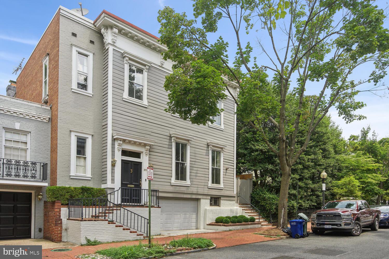 OPEN SUN DEC 10th 2:00-4:00pm! Built in the 1860s, this charming semi-detached residence is nestled in the heart of East Georgetown. Situated among a collection of handsome houses, the stunning property offers a unique opportunity to experience the timeless elegance of the neighborhood. Step inside 3115 O Street NW and be greeted by the gracious living room, a space that sets the stage for countless entertaining possibilities. Adjacent to the living room, an open chef's kitchen awaits. The kitchen seamlessly connects to a cozy family room, allowing for effortless interaction between these two spaces. Both the kitchen and family room offer direct access to a truly exceptional, deep-walled garden, creating a seamless flow between indoor and outdoor living through two sets of elegant French doors. With 4 spacious Bedrooms, 3.5 Baths, and covered garage parking, this quintessential Georgetown home is a rare opportunity!