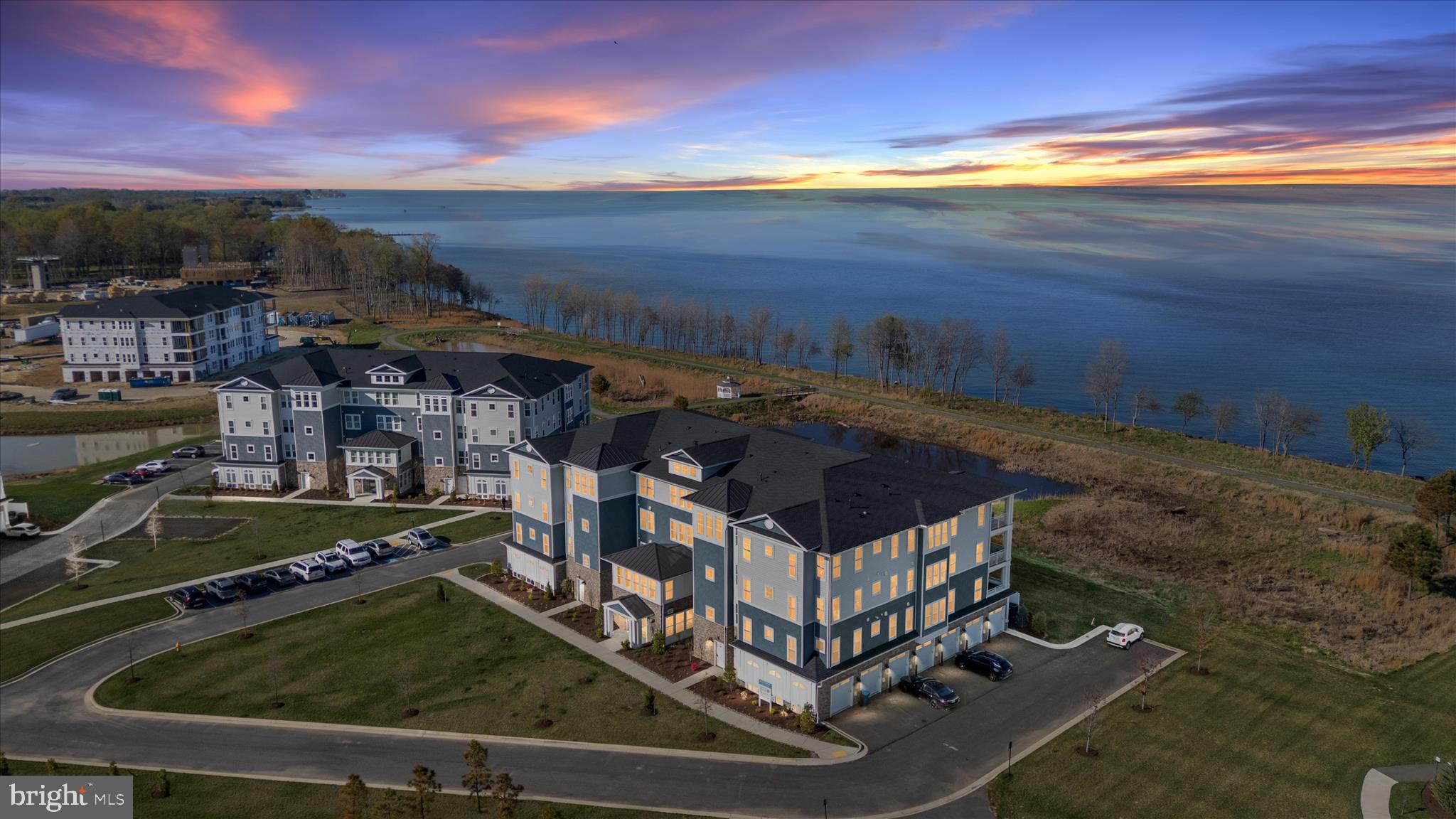 Experience everything Four Seasons has to offer without the wait. This meticulously maintained home shows like new and is located just steps from the community amenities and vibrant social spaces that make Four Seasons so desirable.

132 Wheelhouse Way is arguably one of the most sought-after locations in the community, offering fantastic water views and convenient ground-level access. Simply step out your patio door, turn right, and within moments you are at the resort-style amenities. No other location offers easier access to everything Four Seasons provides.  With a $160,000 lot premium when this was built, its proximity to amenities is arguably the best in the community.  
The open-concept living and dining areas feature beautiful water views, an electric fireplace, and an inviting layout perfect for relaxing or entertaining. This condo has over $60,000 in builder upgrades and it shows.  The gourmet kitchen includes quartz countertops, upgraded stainless steel appliances, GE Café double wall ovens, a large pantry, and luxury vinyl plank flooring throughout.
The primary suite offers peaceful river and pond views, patio access, a walk-in closet, and an upgraded en-suite bath with a walk-in shower. A second bedroom suite with private bath and water views is ideal for guests, while the office with French doors provides flexible additional space.
Additional highlights include elevator access, private storage, attached garage parking, cart storage, and a dedicated laundry area.
Life at Four Seasons at Kent Island extends far beyond the home itself, offering a true resort-style lifestyle. Residents enjoy access to the Chester House Clubhouse, indoor and outdoor pools, a fitness center, walking trails, pickleball and tennis courts, a kayak launch, fishing pier, dog park, and more. Whether relaxing at the tiki bar and fire pit or connecting with neighbors at community events, every day feels like a getaway. Perfectly located on Kent Island with the Chesapeake Bay as the backdrop, this community offers the ideal blend of relaxation, recreation, and coastal living.