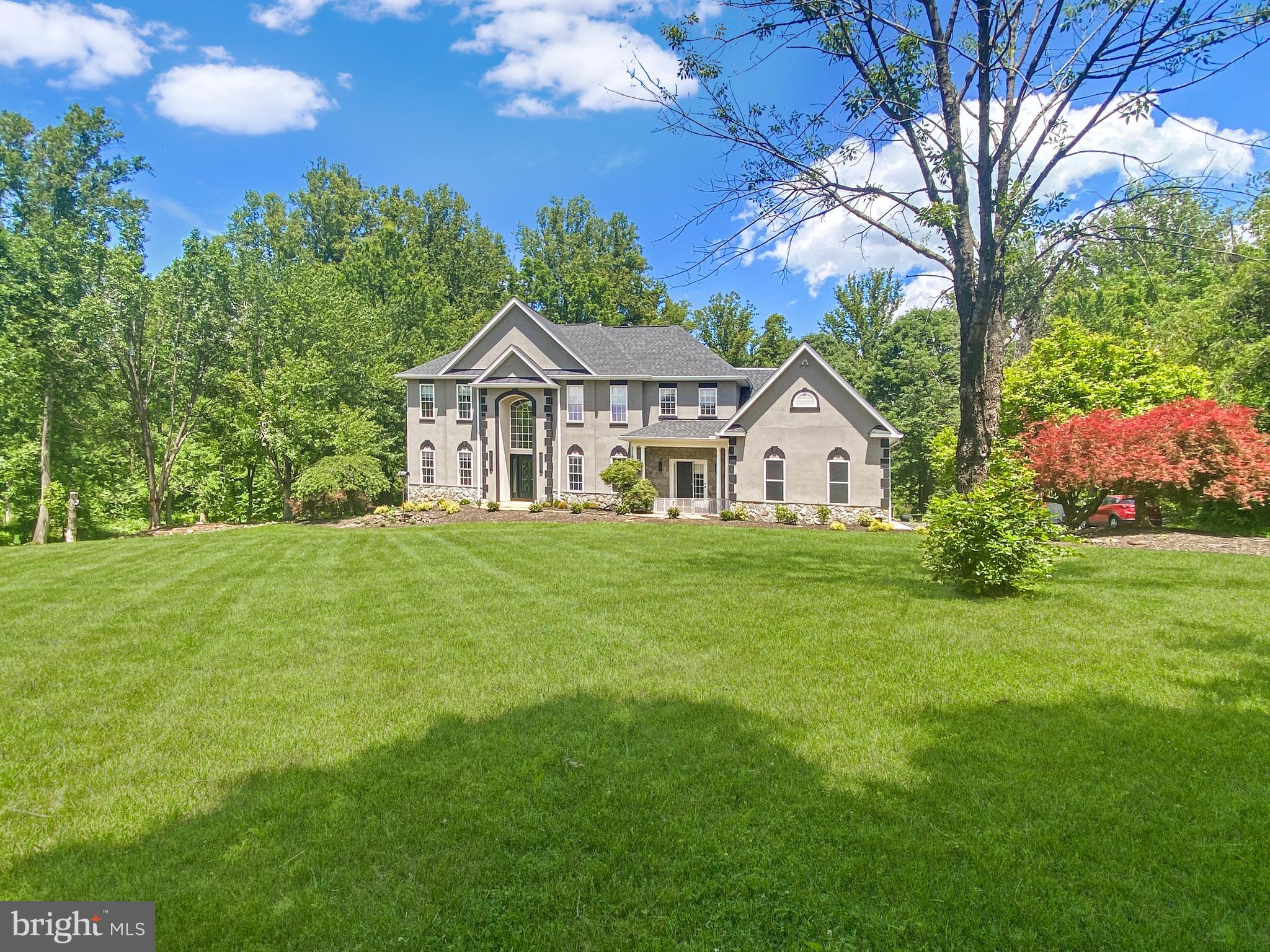 A rare opportunity to own 11.41 private wooded acres in Haymarket, complete with an updated home, 3-car side-load garage, and an impressive detached workshop! This exceptional property offers the perfect blend of privacy, space, and modern updates. A long driveway leads to the home, where a wide paved parking area provides abundant guest parking and makes turning around easy. In addition to the attached 3-car side-load garage, the property features an impressive approximately 50' x 30' workshop/outbuilding tucked farther down the driveway with bay doors and pedestrian access, offering endless possibilities for hobbyists, contractors, car enthusiasts, or additional storage. A separate storage shed provides even more storage space.<p>Inside, the bright and open floor plan showcases wide-plank luxury vinyl plank flooring throughout the main level, fresh interior paint, custom lighting, and a dramatic two-story foyer highlighted by a large Palladian window. A brand-new custom front door with decorative glass inlay and sidelights creates a stunning first impression.<p>The remodeled kitchen features granite countertops, stainless steel appliances, a smart refrigerator, built-in microwave and wall oven, center island with cooktop, 42" soft-close cabinetry, roll-out drawers, and abundant cabinet and counter space. The adjoining sunroom is filled with natural light from four Palladian windows and offers access to the deck through a sliding glass door.<p>The family room boasts built-in shelving, three Palladian windows, and a fireplace, while formal living and dining rooms provide ideal spaces for entertaining. A main-level study connects to a private bedroom suite featuring patio access through a glass-panel door and a beautifully remodeled ensuite bath with a custom walk-in shower and Harrow smart-sensor toilet. A convenient main-level laundry room and rear staircase provide easy access to the upper level.<p>Upstairs, the overlook hallway provides views of the grand foyer below. The spacious primary suite features a tray ceiling, private balcony access through glass-panel doors, a large walk-in closet with custom organization system, and a luxurious bath with jetted soaking tub, separate shower, and dual vanities. Three additional bedrooms complete the upper level, including one with a private ensuite bath and two with walk-in closets that share a dual-entry bath featuring a double-bowl vanity. With three full bathrooms on the upper level, the home offers exceptional comfort and convenience for family and guests.<p>The finished walkout lower level offers exceptional flexibility with a large recreation room, wet bar with cabinetry and refrigerator, bedroom with walk-in closet and full-size windows, two full bathrooms, a second wet bar with soft-close cabinetry and an additional refrigerator, and a large unfinished storage area with framing already in place for future expansion. Glass-panel doors provide walkout access to the rear patio and backyard.

Additional updates include fresh interior paint, a brand-new custom front door with decorative glass inlay and sidelights, brand-new carpet on the upper level, newer wide-plank LVP flooring, remodeled lower-level bathroom completed in November 2025, newer windows, a remodeled kitchen approximately seven years ago, Nest thermostats, and a roof replaced approximately eight years ago.<p>Enjoy the peace and privacy of country living without sacrificing convenience. You'll have easy access to shopping, dining, grocery stores, medical facilities, wineries, breweries, golf courses, and major commuter routes, including I-66, Route 15, and Route 29. This rare property offers the space, flexibility, privacy, and lifestyle that are increasingly difficult to find in Northern Virginia.
