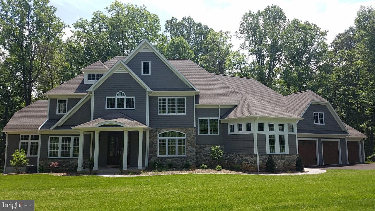 Extraordinary new custom home by Greystone Const. set on a beautiful, wooded, 1.20 Ac. lot. Dramatic open plan features Gourmet Kitchen and Morning room open to Great room with 14 ft. ceiling & an atrium wall of windows. First floor includes Master suite with elegant bath, Den/Study, and Guest suite. Second floor offers 3 Bedrooms and 3 full baths. Screened porch w/fireplace, and large deck overlooks private setting.