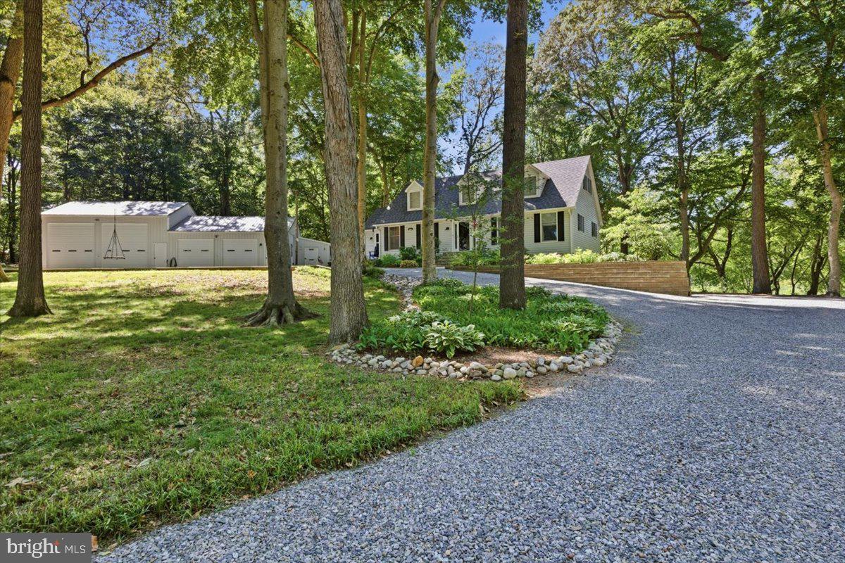 Welcome home to this beautifully maintained 3-bedroom, 2.5-bath Cape Cod, privately nestled off the road for peace and seclusion. Lovingly cared for throughout ownership, this home features numerous major upgrades, offering both quality and peace of mind for its next owner.

Inside, you'll find a warm and inviting floor plan with comfortable living spaces designed for everyday living and entertaining. Outside, the property truly shines with exceptional garage and storage space. A detached 4-bay garage with impressive 15-foot ceilings provides endless possibilities for car enthusiasts, hobbyists, contractors, boat or RV storage, or workshop space. In addition, the home includes an attached one-car garage located beneath the house for added convenience.

Surrounded by a private setting with plenty of room to enjoy the outdoors, this property offers the perfect combination of country charm, modern updates, and outstanding functionality. Whether you're looking for a peaceful retreat or a home with exceptional space for vehicles and equipment, this Cape Cod is a rare opportunity you won't want to miss.