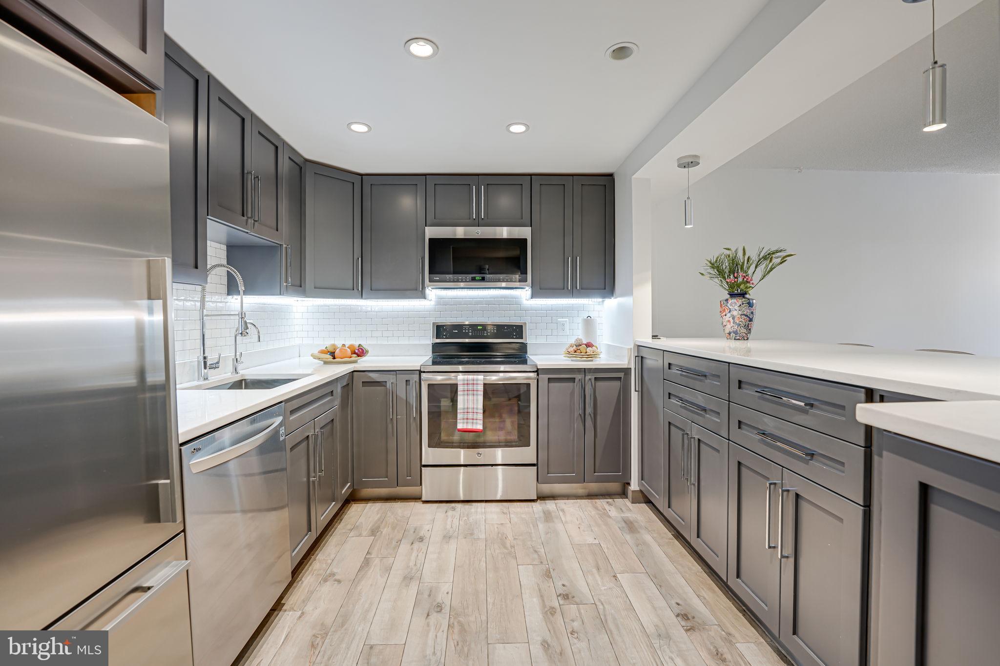Welcome to The Colonies at McLean, a beautifully maintained community spanning 29 acres of park-like tranquility in the heart of Tysons Corner. Step inside to discover a meticulously designed living space where no shortcuts were taken. The unit boasts high-end appliances, custom cabinets, Quartz countertops, a huge integrated kitchen island for entertaining which includes deep cabinets and additional side storage. Premium stainless steel fixtures, and commercial-grade water filtration. The tiled flooring throughout adds to the elegance and ease of maintenance. Designed for modern living, the condo is hardwired for high-speed internet in every room, with concealed wiring in a dedicated closet for easy access to equipment. Audiophiles will appreciate the high-end audio entertainment setup, thoughtfully integrated into the unit. Situated a short distance from this unit is the pathway to the McLean Metro station on the Silver Line, while convenient access to I-495 and I-66 ramps enhances commuting flexibility. Explore shopping and dining options in the Tysons area, with proximity to Capital One Hall, Starr Hill Brewery, Wegmans, Safeway, Trader Joe's, and the vibrant offerings of Tysons Galleria, Tysons Corner, and The Boro. Seize this exceptional opportunity to make The Colonies your new home. Schedule your showing today!