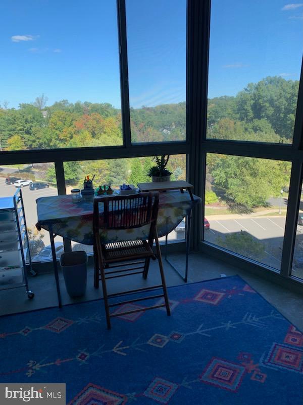NEW PRICE DROP!  THIS IS A LOVELY APARTMENT THAT YOU SHOULDN'T MISS!  ENJOY THE NEXT PHASE OF YOUR LIFE IN THIS BRIGHT, GRACIOUS APARTMENT OVERLOOKING TREES AND GREENERY.  TWO GENEROUS BEDROOMS WITH ENSUITE BATHS; SPACIOUS LIVING ROOM WITH SLIDING GLASS DOORS TO THE PERFECT ENCLOSED BALCONY (GLASS AND SCREEN); DINING ROOM WITH BREAKFAST BAR OR PASS THRU (OR BOTH, YOUR CHOICE!) FROM THE TABLE SPACE KITCHEN.  DON'T FORGET TO NOTICE THE LOVELY AND WORRY-FREE LVP FLOORS THROUGHOUT.  BUILDING HAS A COMMUNITY ROOM FOR PARTIES AND GATHERINGS (OR JUST RELAXING AND READING A BOOK FROM ITS HONOR-SYSTEM LIBRARY); GRACIOUS BUILDING ENTRY AND LOBBY; AND THREE ELEVATORS (NO WAITING!).