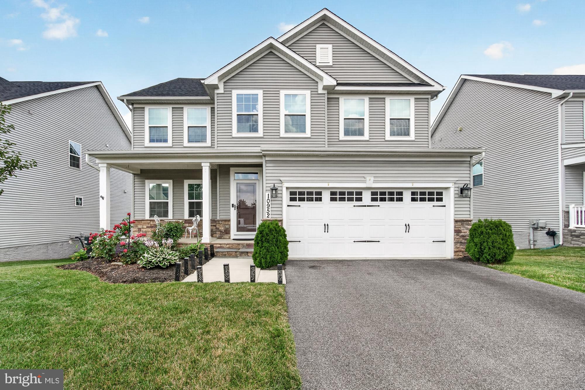 Welcome to 10952 Ginger Lane in Monrovia, MD in the Landsdale Community. This exceptional 5-bedroom, 4-full-bath Colonial offers the perfect combination of luxury, functionality, and an ideal location.
The thoughtfully designed floor plan features a main-level bedroom with its own private ensuite full bath, making it perfect for guests, multi-generational living, or a private home office. An additional office with elegant French doors is located just off the foyer, providing the ideal work-from-home space.
Engineered wood flooring flows throughout both the main and upper levels, creating a seamless and gasophisticated look. The gourmet kitchen is a chef's dream, featuring quartz countertops, a gas cooktop, wall oven, built-in microwave, beautiful tile backsplash, and abundant cabinet and counter space for entertaining and everyday living.
Upstairs, you'll find four spacious bedrooms, including an impressive primary suite with an oversized walk-in closet, and additional walk-in closet. The luxurious primary bath offers double vanities with quartz countertops, ceramic tile flooring, and plenty of room to start and end your day in comfort. The convenient upper-level laundry room includes a utility sink and ample cabinetry for additional storage.
The finished walkout lower level provides exceptional flexible living space with a full bath, making it ideal for a media room, recreation area, children's playroom, home gym, or guest accommodations. There is also an abundance of unfinished storage space.
Step outside to enjoy the large Trex® composite deck with stairs leading down to a patio and fully fenced backyard—perfect for outdoor entertaining, relaxing, or letting pets and children play safely.
Located within walking distance of Green Valley Elementary School and just minutes from I-270 and I-70, this home offers an easy commute while providing the comfort and amenities today's buyers are looking for.
Don't miss your opportunity to own this beautifully appointed home in one of Monrovia's most desirable communities!