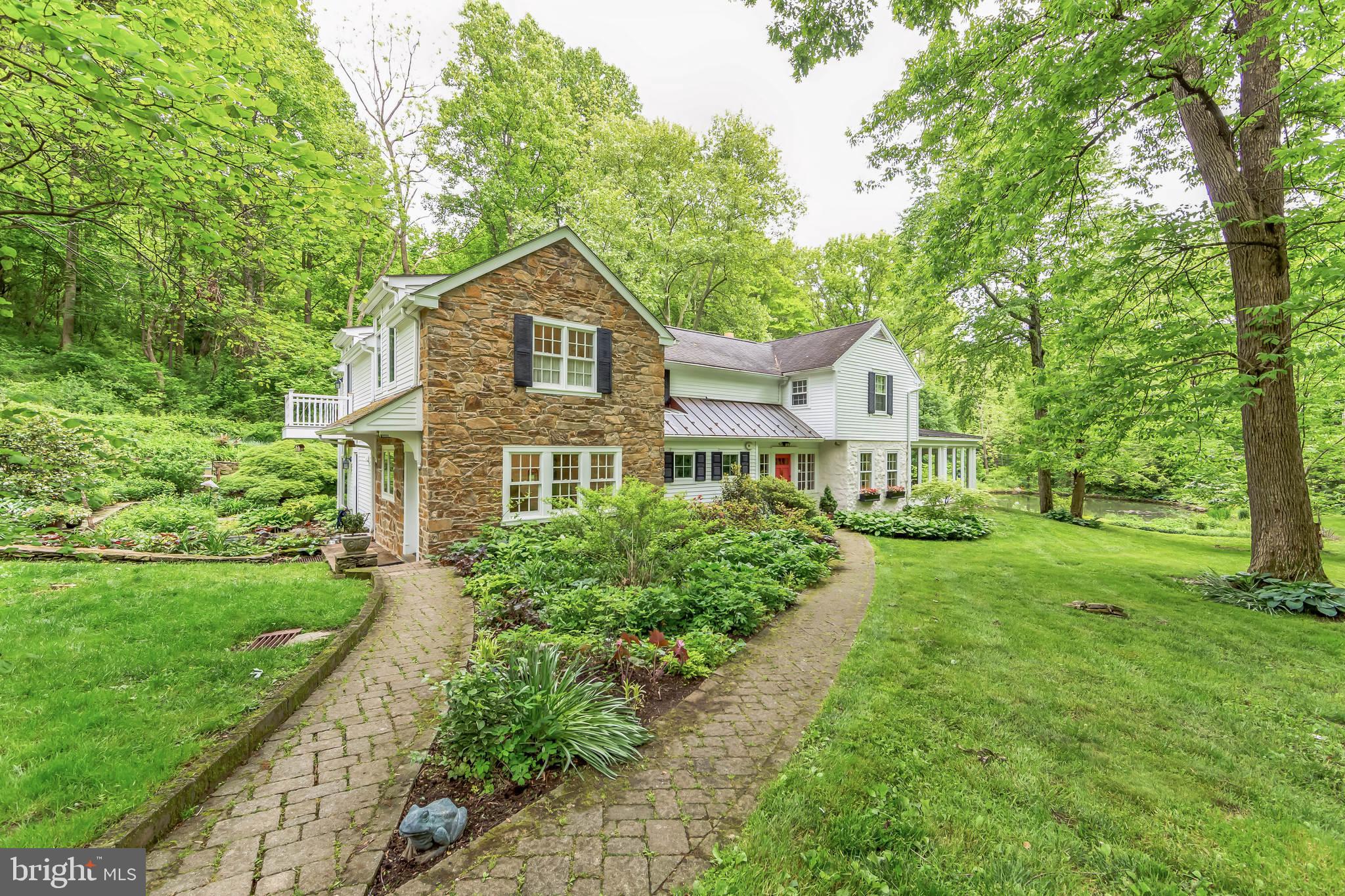 Just right. A country property on a private lane off a quiet
road, offers privacy and gracious living a mile from
Birchrunville, and one of the region’s best restaurants, one
of PA’s 10 best bakeries, and award-winning cheesemaker
who hosts locals on Friday afternoons. Surrounded by
perennial gardens, horse and walking trails, and land that
will not be developed, the 3-bedroom, 3-full bath house
features hardwood floors, oversized kitchen with large
island for casual dining, gas fireplace, sitting area, and
adjoining large butler’s pantry, dining room, library, great
room with wood-burning fireplace, welcoming entry and
reception room, and a large glass- or screen-enclosed 3-
season room overlooking farm pond with koi, and 2 patios.
The primary suite includes a large dressing room with
room for multiple wardrobes and walk-in cedar closet,
large bedroom with balcony, sitting area, gas fireplace and
ensuite bathroom with soaking tub, large, glass enclosed
double shower with custom tile, private toilet room, and 2
separate sinks and vanity. The second floor also includes
2 additional bedrooms, full bath, and laundry/craft room
that could also be repurposed as a fourth bedroom. The
property includes an attractive 3-stall barn with overhang,
loft and storage room, paddock and fenced one-acre
pasture. An outbuilding houses a 2-car garage with EV
charging station and in-law or guest suite with full bath and
kitchenette. Another outbuilding accommodates 2 more
cars and additional storage space. Whole house propane generator. Minutes from the
turnpike, and 30 minutes to King of Prussia.
Not too big and not too small. Just right for Goldilocks, or
you.