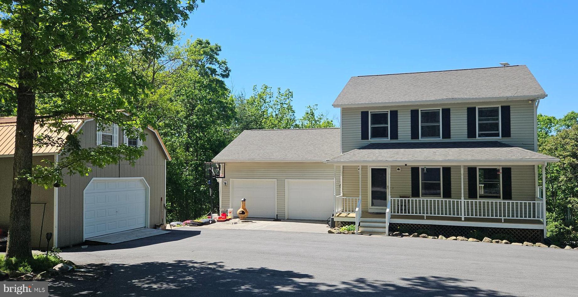 THIS HOME HAS COUNTRY CHARM ALL OVER IT.  SWIM IN THE IN-GROUND POOL W/NEW POOL LINER, OR DIP YOUR TOES IN THE BEAUTIFUL CREEK, SMORES BY FIRE PIT, MULTIPLE ATV TRAILS THROUGHOUT, SEVERAL DETACHED GARAGES ONE WITH A LOFT, MULTIPLE FRUIT TREES, GOURGOUS FLOWERS, LOTS OF PRIVACY ON THIS 7.83 ACRE LOT. JUST 15 MILES TO WINCHESTER COME CHECKOUT THESE 3 FINISHED LEVELS IN THIS COLONIAL WITH 3-4 BEDROOMS 3.5 BATH, COUNTRY KITCHEN WITH BREAKFAST BAR, SOME STAINLESS-STEEL APPLIANCES, GENEROUS SIZE DINING ROOM THATS OPEN TO THE BACK DECK & FRONT ROOM. POWDER ROOM. THEN UP 2ND LEVEL TO  3 BEDROOM 2 FULL BATH. GO DOWN TO THE FINISHED BASEMENT A FULL BATH WITH A LARGE WALK-IN SHOWER & COUPLE OF FINISHED ROOMS (GREAT FOR OVERNIGHT GUEST) FROM HERE WALKOUT TO THE POOL THAT IS SURROUNDED BY SEVERAL PATIOS TO RELAX ON.  NEW HVAC. ELECTRIC UNDERGROUND. LOTS OF WILDLIFE FOR FEEDING OR HUNTING MORE PICS COMING!!! SO, IF YOU'RE SEARCHING FOR A HOME THIS ONE CHECK ALOT OF BOXES.