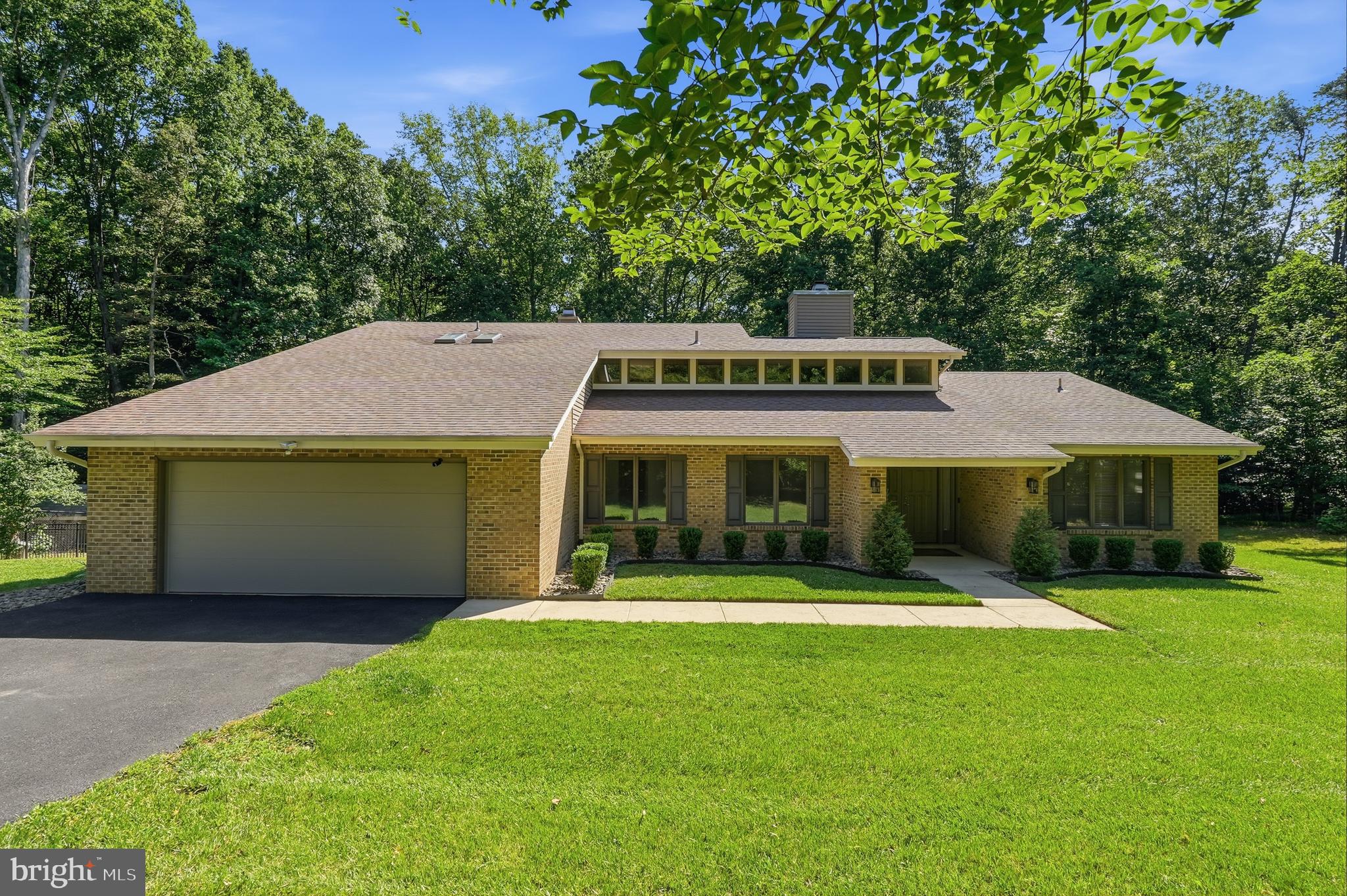 Looking for privacy, space, and no HOA? This 4-bedroom, 3 full bath home sits on 5 acres in White Plains and offers over 2,800 square feet of above-grade living space.

The owners have updated the interior with NEW luxury vinyl plank flooring throughout, giving the home a fresh, modern feel. The main level features soaring ceilings, a spacious living room with a wood-burning fireplace, an updated kitchen with stainless steel appliances (including a NEW refrigerator), a large island with seating, plenty of cabinet space, and a pantry. Three bedrooms and two full bathrooms are also located on the main level.

The upper-level primary suite provides a private retreat with a walk-in closet, double vanity, separate shower, and a sitting area with a pellet stove. Step outside onto your private deck and enjoy the peaceful wooded views that surround the property.

One of the standout features of this home is the land. The 5-acre lot offers a great balance of open and wooded space, with approximately one cleared acre surrounding the home and the remaining acreage providing privacy, natural beauty, and room to explore. The fully fenced backyard is ideal for pets, play, and outdoor entertaining, with gates on both sides of the home and an additional gate providing access to the wooded portion of the property.

The flat backyard includes a poured concrete pad that offers endless possibilities—from a fire pit gathering area to a basketball hoop, outdoor seating area, or future outdoor living space. Two decks provide additional places to relax, entertain, and enjoy the peaceful setting.

Inside, a second living area with a pellet stove offers flexible space for a family room, recreation room, home office, or hobby space.

Outdoor enthusiasts will appreciate the nearby public boat ramps and easy access to the Indian Head Rail Trail, with multiple trail access points just minutes away. Shopping, dining, and everyday conveniences are close by in both La Plata and Waldorf, giving you the space and privacy of country living without sacrificing convenience.