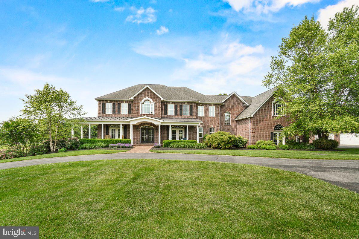 Welcome to your own private sanctuary! Nestled on over 26 acres, this grand colonial estate is a rare blend of timeless elegance, refined comfort, and breathtaking outdoor living.

From the moment you arrive, the circular driveway and sweeping views set the stage for something truly special. Step inside to a dramatic two-story foyer that leads into light-filled living spaces, rich hardwood floors, and a gourmet kitchen designed for gathering and entertaining. French doors open from the family room—anchored by a stunning stone hearth fireplace—out to the backyard oasis.

Outdoors, every detail invites relaxation and celebration. Enjoy evenings under the covered patio or pergola, take a dip in the sparkling pool, and enjoy the beautifully landscaped grounds that roll into uninterrupted views as far as the eye can see.

This home has six spacious bedrooms and four full bathrooms on the upper level, with two additional half baths on the main floor. The fully finished lower level includes a full bath and plenty of flexible space for recreation or guests. A three-car attached garage and detached carriage house offer ample storage.

Impeccably maintained and thoughtfully designed, this is more than a home—it’s a legacy property meant to be cherished for generations.

Run, don’t walk—this extraordinary slice of heaven won’t last long.