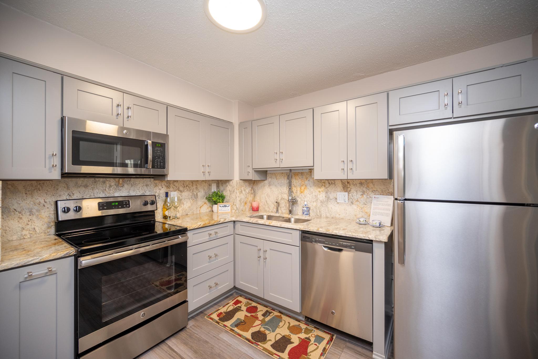 Welcome home to carefree living in this vibrant 55+ community! This spacious and beautifully updated condo offers the perfect blend of comfort, convenience, and modern style. Featuring two generously sized bedrooms, two full bathrooms, and a coveted indoor garage parking space, this move-in-ready home has everything you need. Enjoy fresh paint throughout, brand-new carpeting in both bedrooms, and a fully renovated gourmet kitchen. Whether you're looking to downsize without compromise or embrace an active, maintenance-free lifestyle, this exceptional home is ready for you. The community offers an impressive array of amenities. Residents enjoy access to two clubhouses, indoor and outdoor swimming pools, tennis and pickleball courts, an 18-hole golf course, a convenient on-site medical center, as well as a restaurant and bar for social gatherings. For those who enjoy the outdoors, community gardens and walking paths provide a perfect place to connect with nature. With a wide variety of clubs and activities, there’s always something to do.