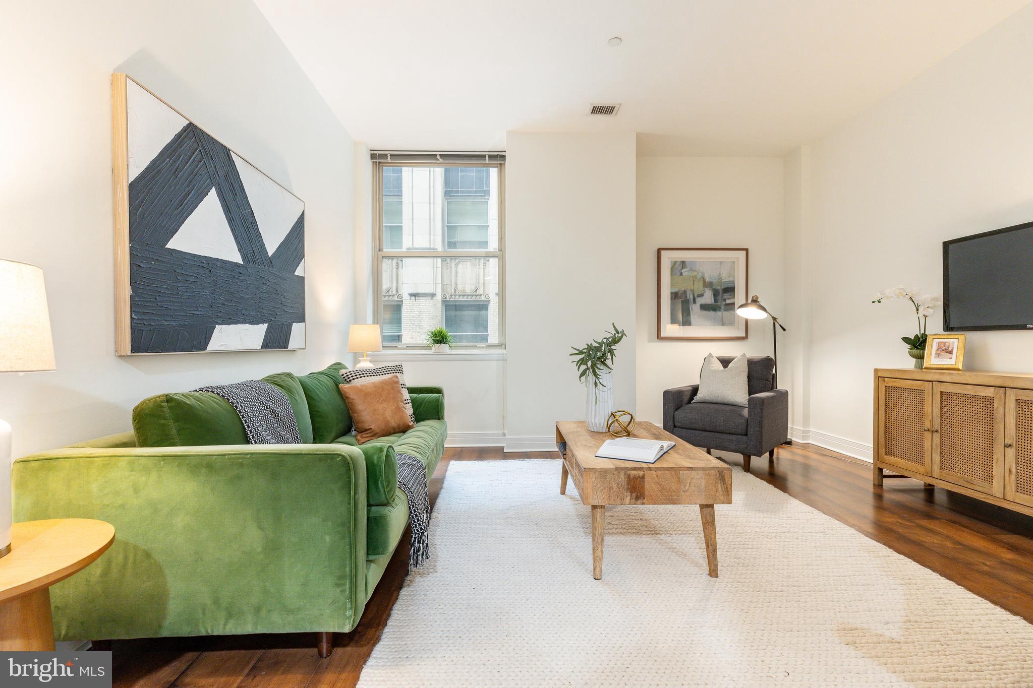 Experience elevated urban living at the iconic Phoenix located at 1600 Arch Street in Center City Philadelphia. This spacious seventeenth floor residence offers a sophisticated one bedroom and one bathroom open floor plan layout characterized by soaring high ceilings and large windows.  The residence features a rare floor plan that includes a large kitchen and formal dining area perfect for entertaining guests or enjoying a quiet meal at home. The spacious primary suite features two custom closets including a walk in closet with premium organizational systems. For added convenience the unit includes an in unit washer and dryer as well as a private dedicated storage locker located on the fourth floor of the building.All of this is set within a prestigious five star amenity building designed for the modern lifestyle. Residents enjoy a gorgeous state of the art fitness center and weight room along with an elegant community room and a stunning rooftop terrace providing panoramic views of the city skyline. With twenty four hour concierge service and the unique convenience of direct elevator access to Suburban Station commuting is entirely effortless and weather proof.The location puts you at the epicenter of Philadelphias world class culture and dining. You are just a short eight minute stroll from the beauty of Rittenhouse Square and steps away from the iconic Comcast Center. This nearby landmark offers the spectacular Comcast Experience video wall as well as the Vernick Coffee Bar and the upscale dining and retail options within the Comcast Technology Center. Explore the surrounding neighborhood including the Barnes Foundation and a variety of dining choices ranging from the on site Starbucks and Tir Na Nog to the nearby culinary landmarks of Center City. While the proximity to transit is unbeatable several parking options are available in the immediate vicinity including the Love Park Garage. This unit at The Phoenix represents the ultimate Center City sanctuary for those seeking luxury and convenience